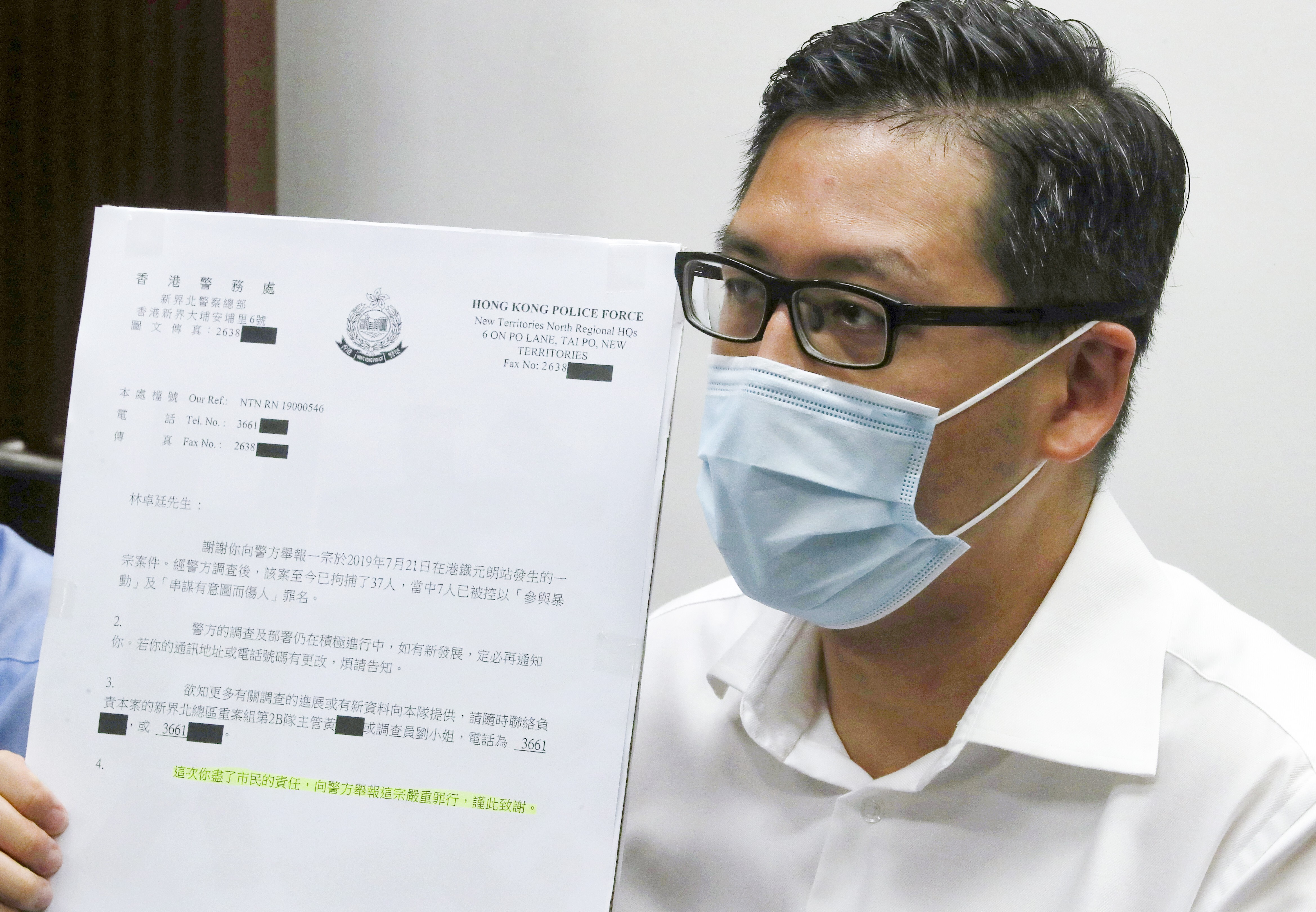 Democratic Party lawmaker Lam Cheuk-ting displays the letter he received from police thanking him for ‘fulfilling’ his responsibility in reporting the crime. Photo: Edmond So