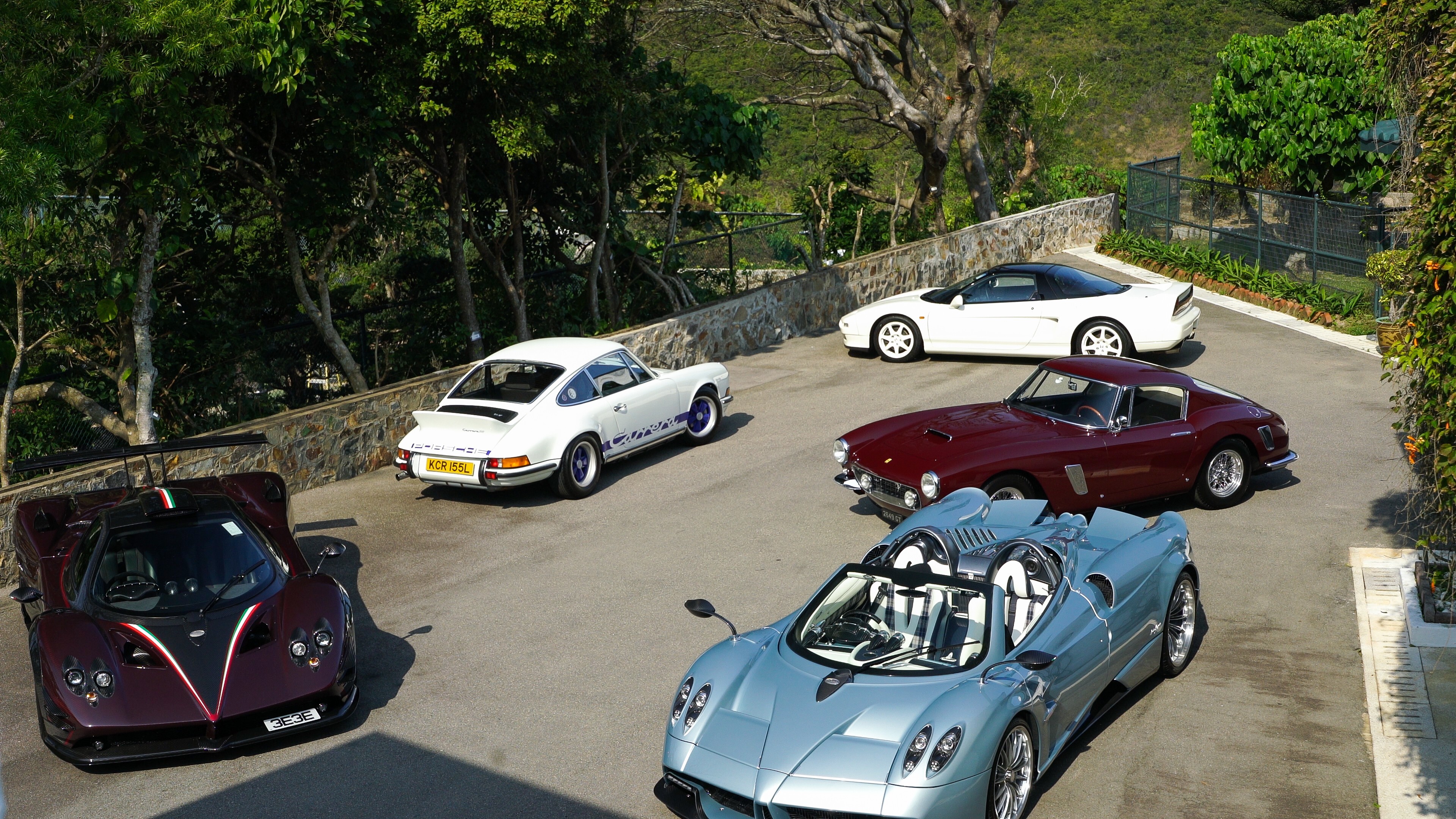 These are just five of the cars that make up Jonathan Hui's swoon-worthy car collection: (from left) a Pagani Zonda Fantasma Evo, a 1973 Porsche Carrera 2.7 R.S, a Honda NSX, a 1961 Ferrari 250 short wheelbase and a Pagani Huayra Roadster. Photo: Bridgette Hall
