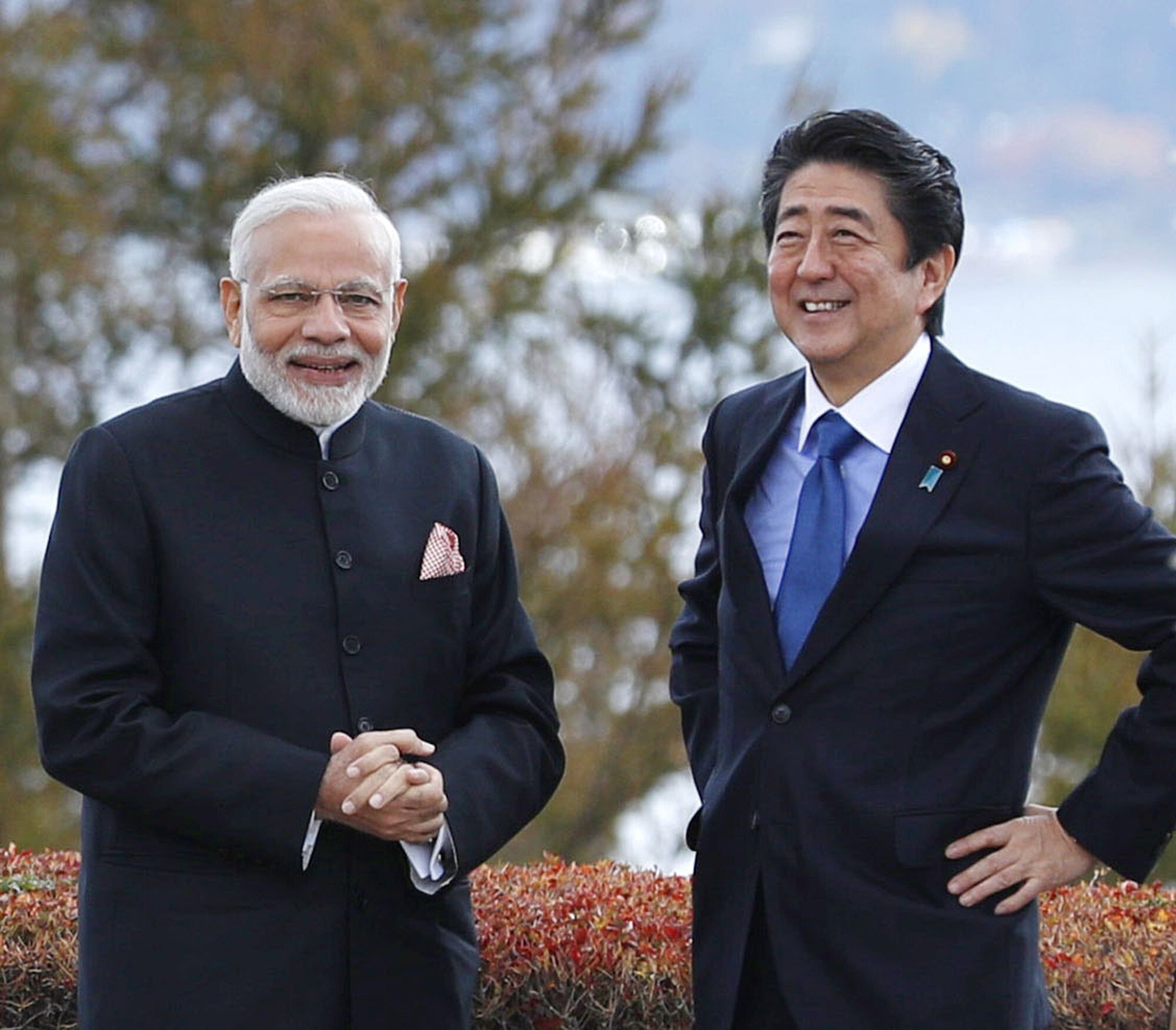 India’s Prime Minister Narendra Modi and Japan’s Prime Minister Shinzo Abe share a light moment in a hotel garden in Yamanakako village, Yamanashi prefecture, Japan, in October 2018. Photo: AP