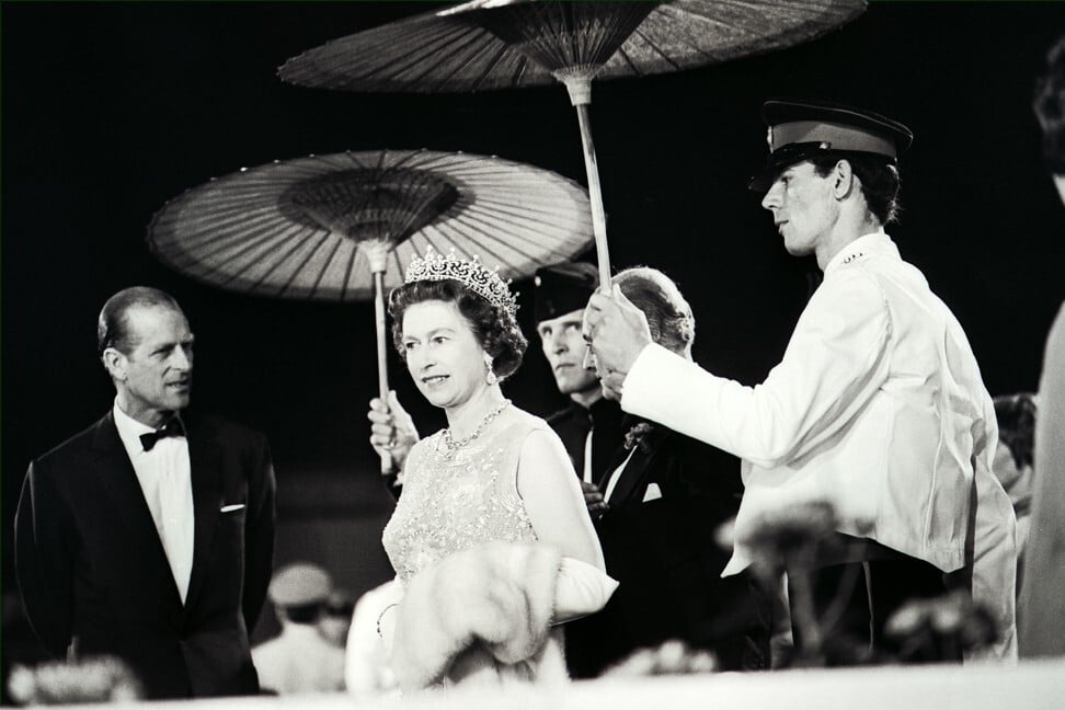 Drizzle could not dampen the glittering street procession honouring Queen Elizabeth and Prince Philip. Photo: SCMP