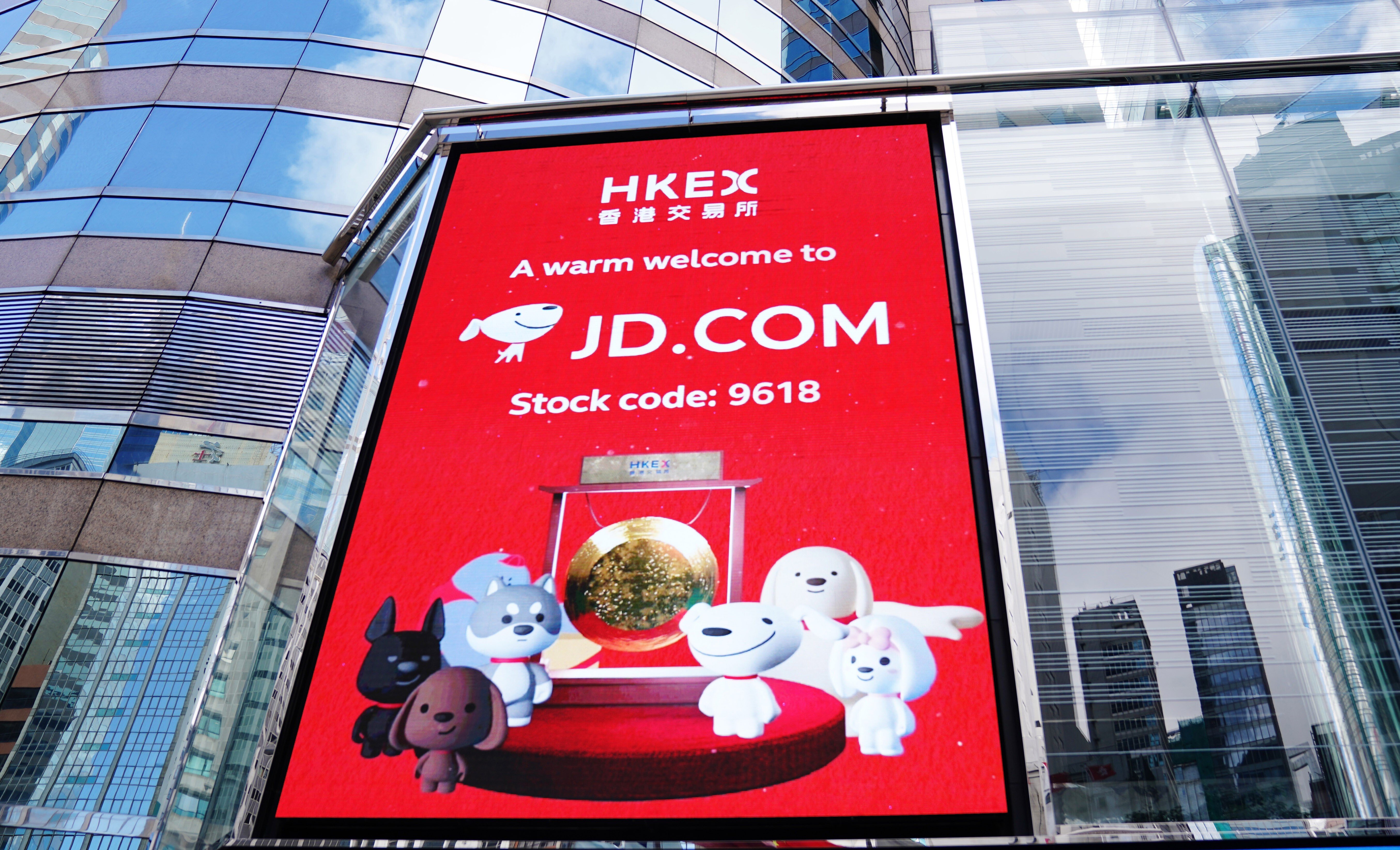 A screen showing the listing of JD.com in Hong Kong outside the trading hall of Hong Kong Exchanges and Clearing on June 18. Photo: Xinhua