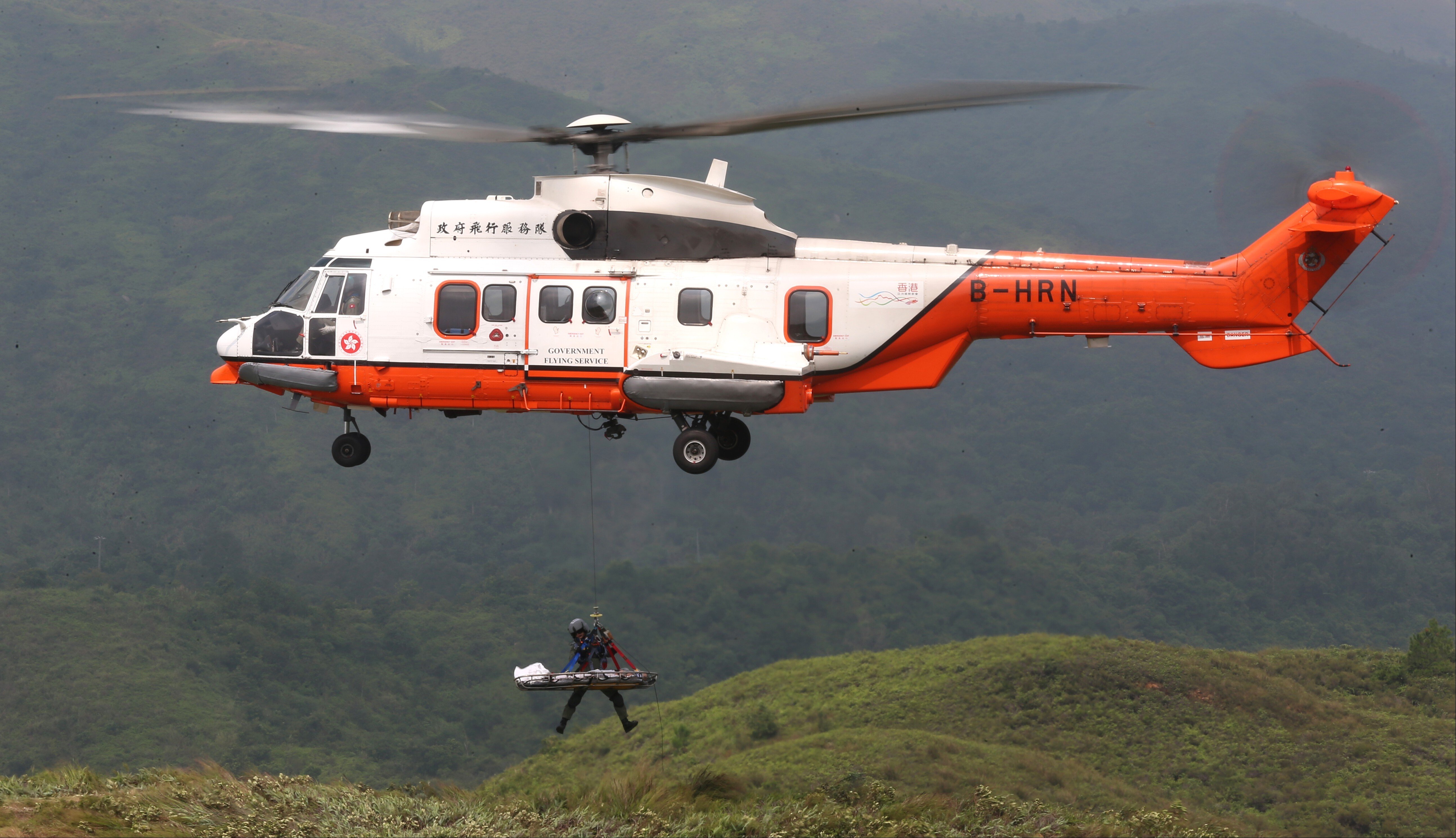 Hong Kong’s fire and flying services personnel, the Hospital Authority, and other government bodies hold an interdepartmental exercise simulating a vegetation fire and mountain rescue operation, in Lam Tsuen Country Park in the northern New Territories. Photo: K.Y. Cheng