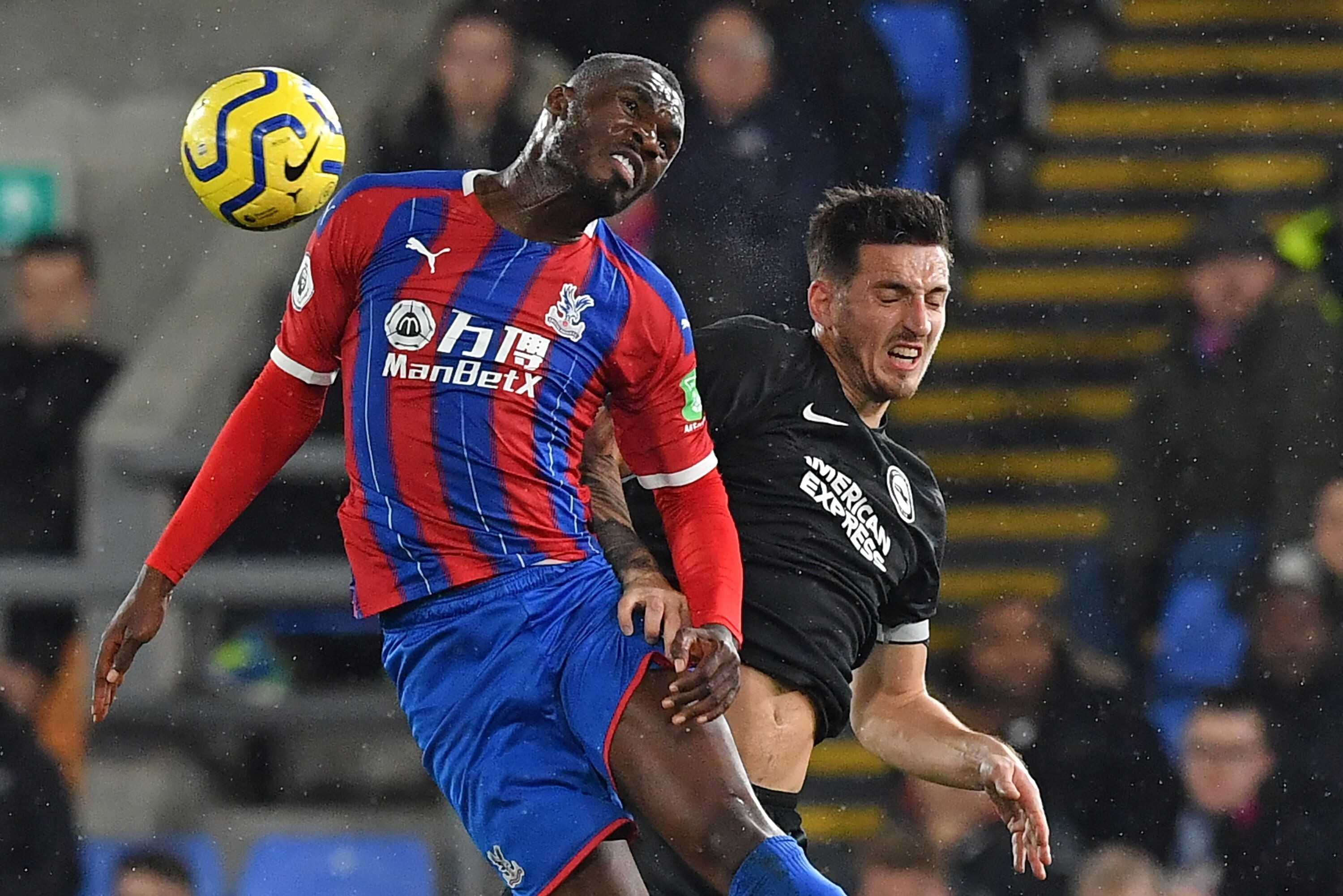 Brighton's Lewis Dunk vies with Crystal Palace's Christian Benteke in the English Premier League. Photo: AFP