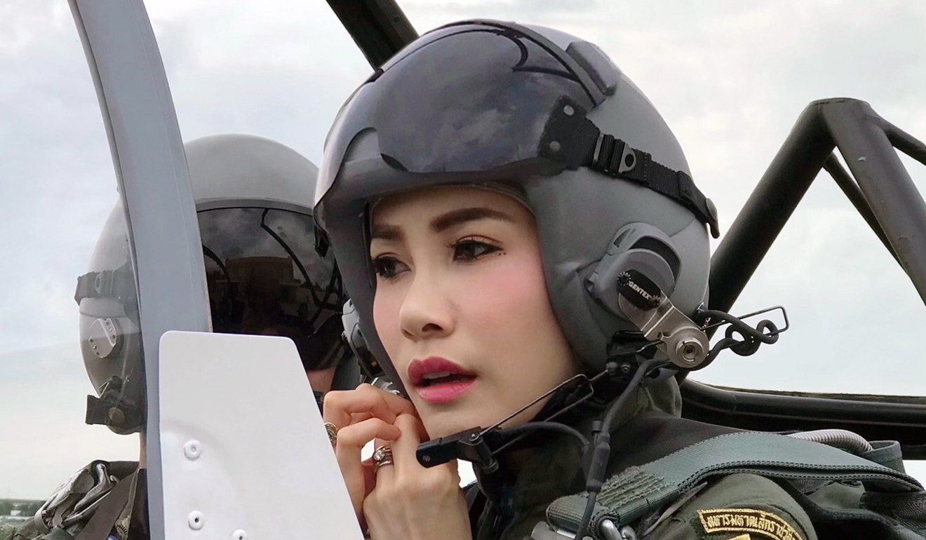 Sineenat Wongvajirapakdi adjusting her pilot’s helmet in a military aircraft during training. Photo: EPA