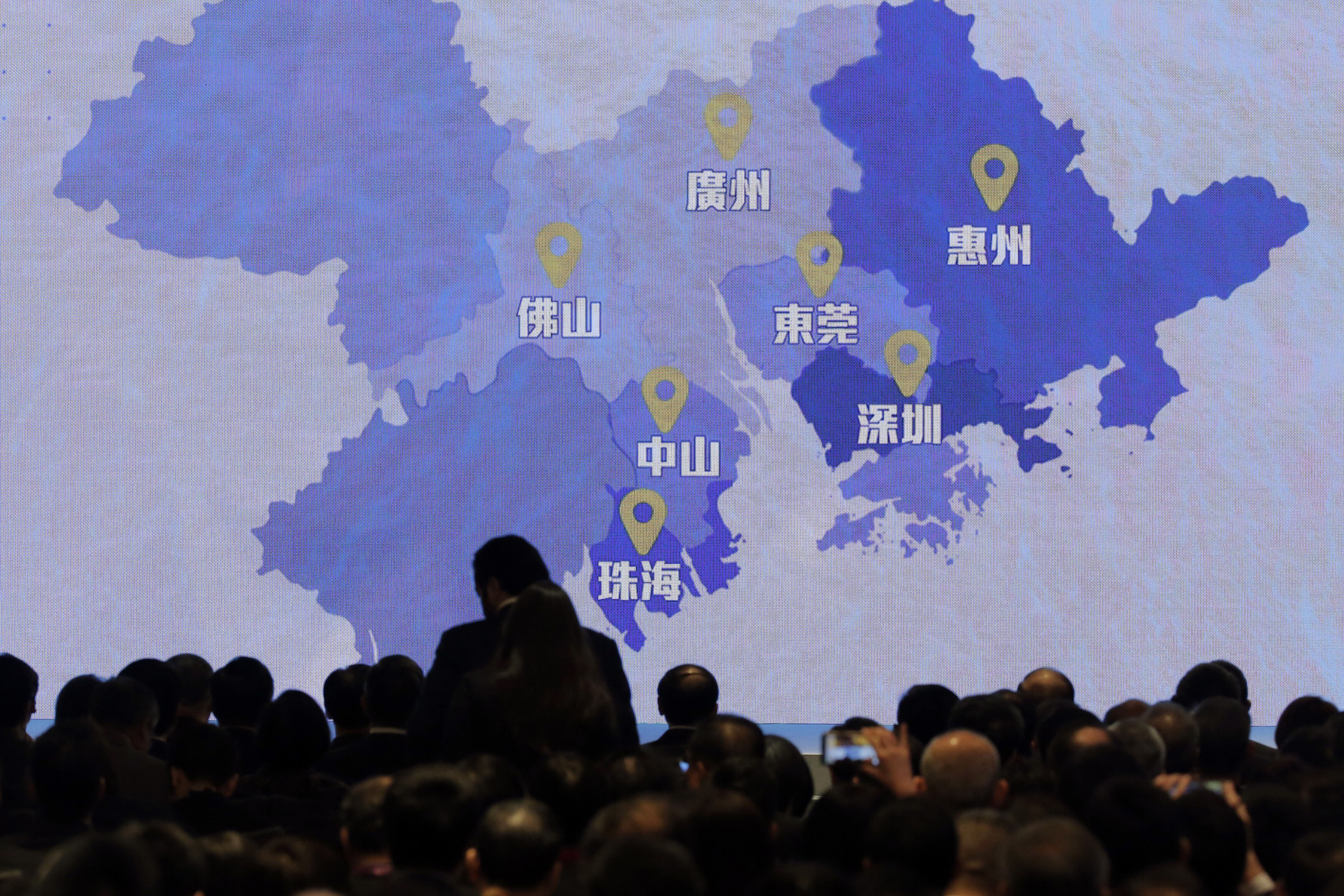 A screen shows a map of Greater Bay Area during a symposium on the "Outline Development Plan for the Guangdong-Hong Kong-Macao, Greater Bay Area" in Hong Kong on Thursday, February 21, 2019. Photo: AP