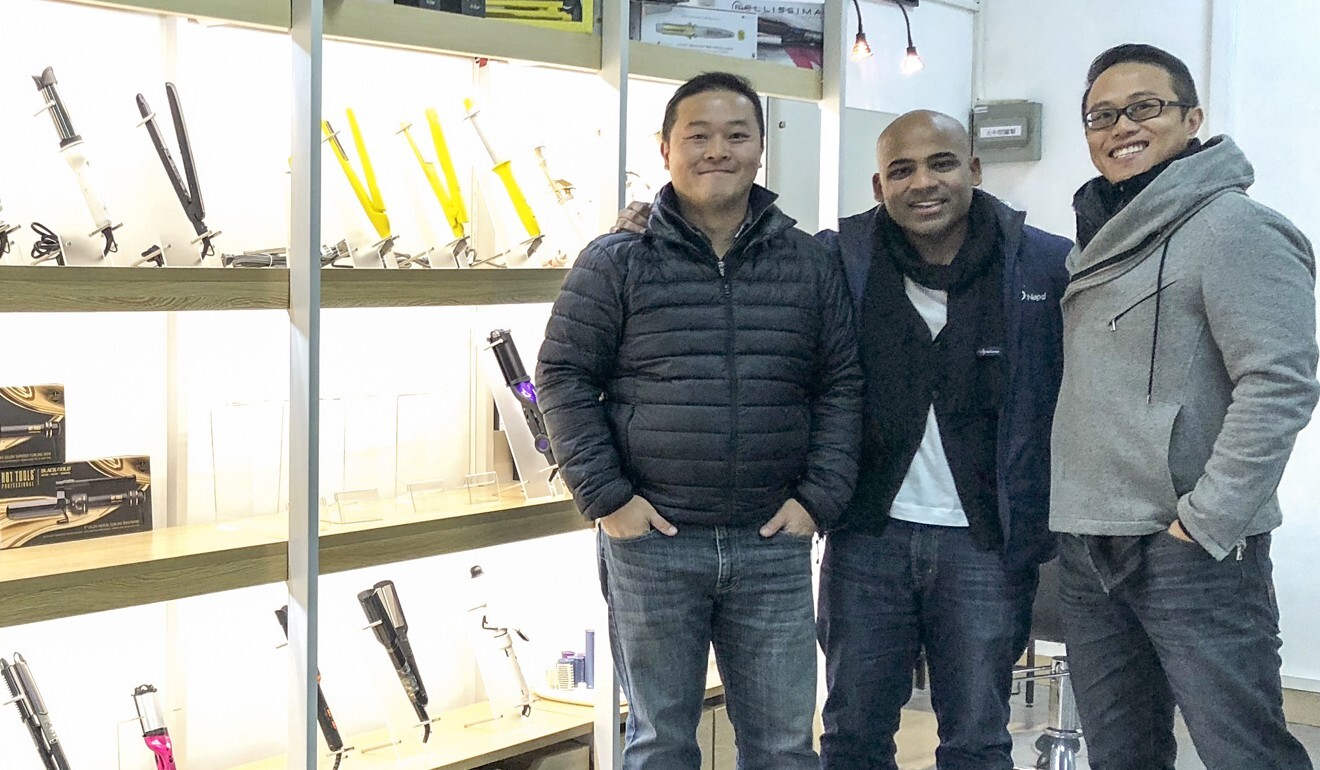 Herbert Lun (left), managing director of Wing Sang Bakelite Electrical Manufactory Limited, in a Shenzhen showroom with a client. Photo: Handout