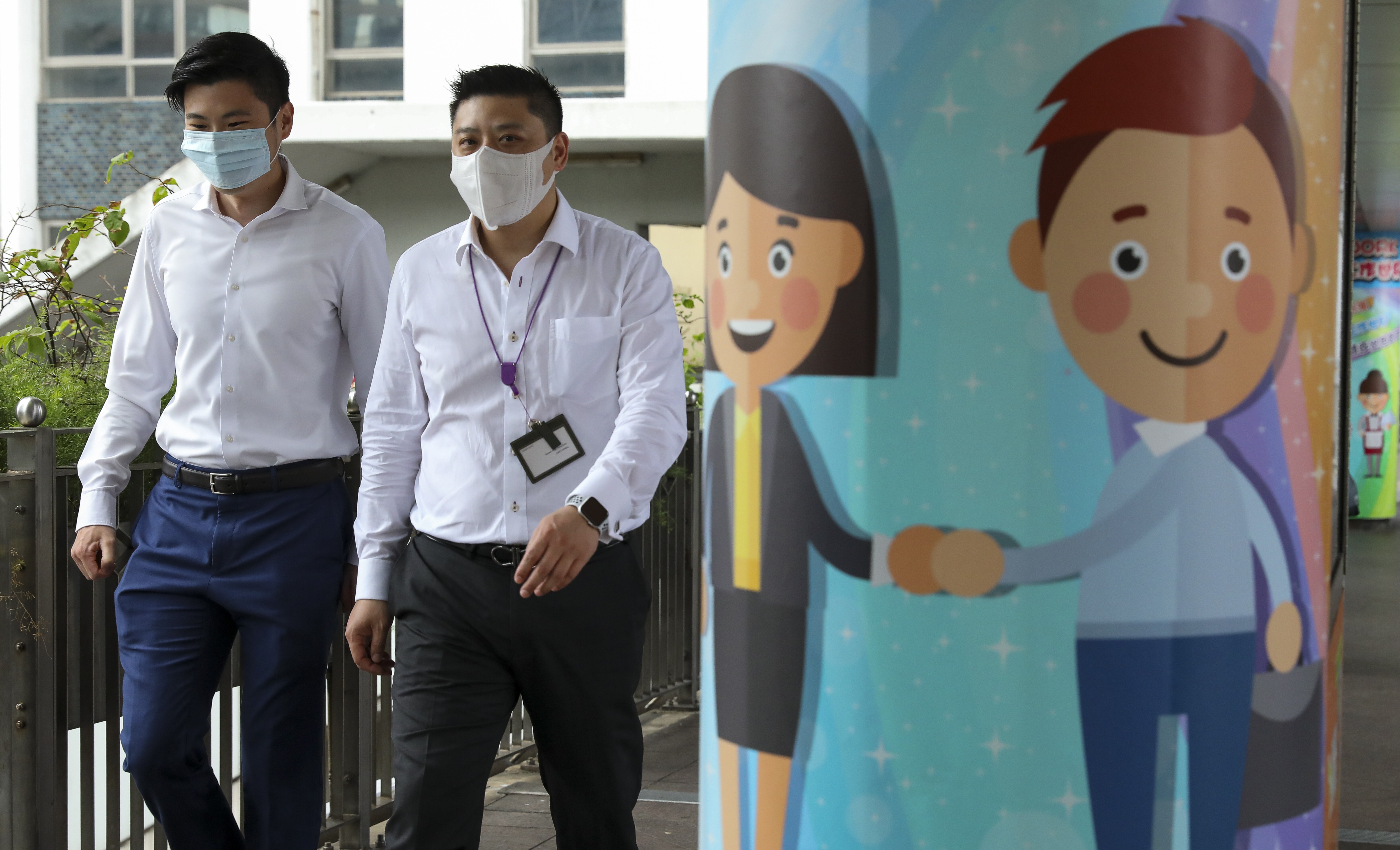 Pedestrians walk past a mural in the Central district of Hong Kong during a coronavirus disease outbreak in the city, on July 20. Photo: handout