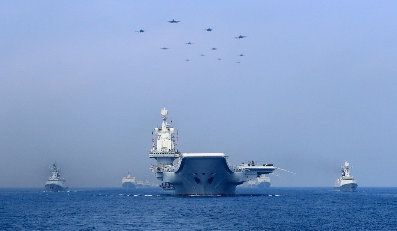 Warships and fighter jets of the Chinese People's Liberation Army Navy in the South China Sea. Photo: Reuters