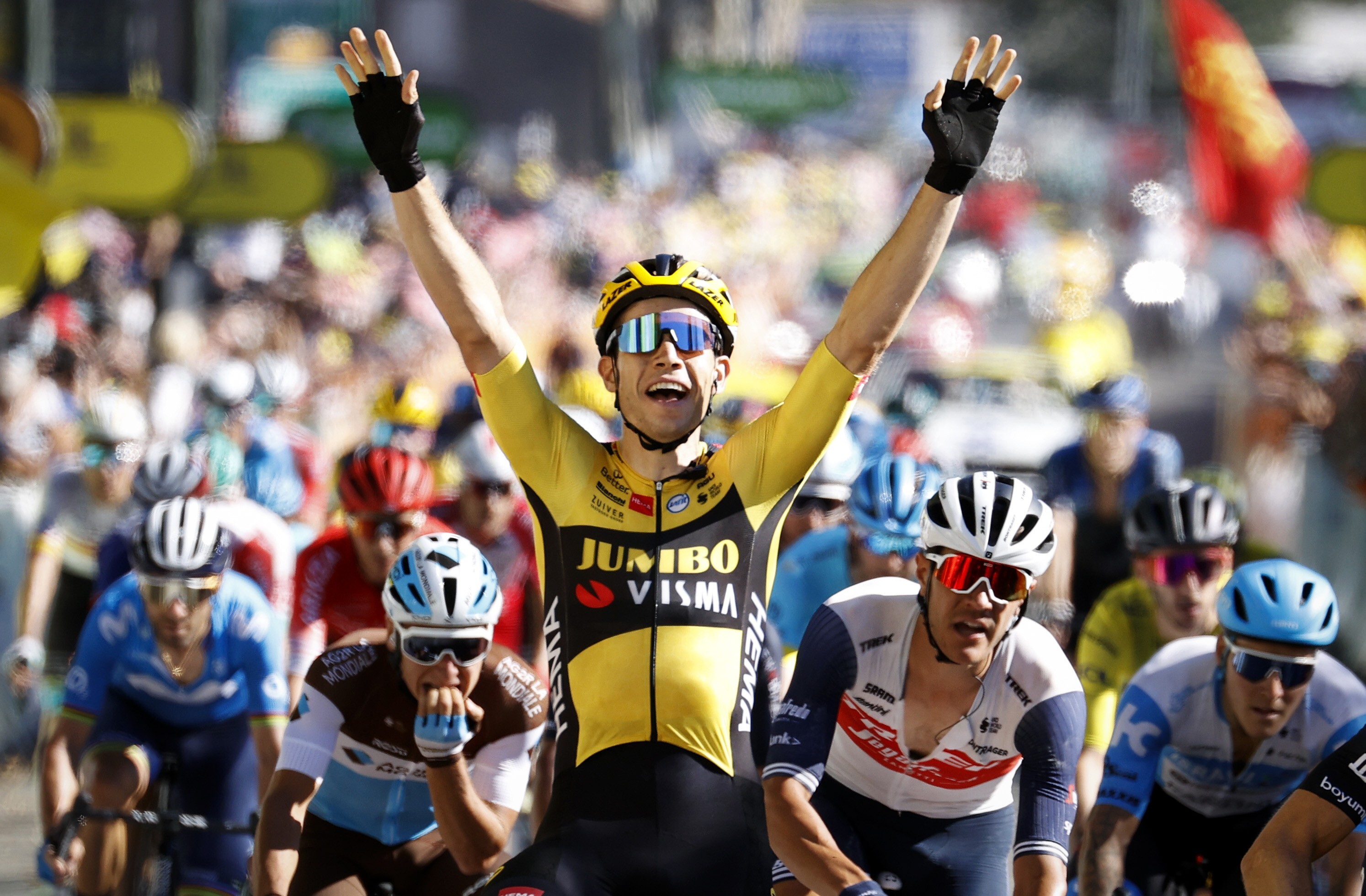 Belgian cyclist Wout Van Aert of Team Jumbo-Visma celebrates as he crosses the finish line to win the seventh stage of the Tour de France. Photo: DPA