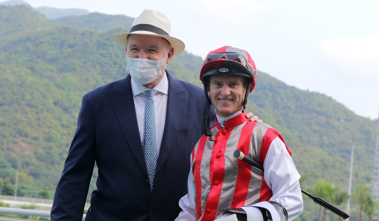 Trainer David Hayes and jockey Zac Purton celebrate Metro Warrior’s victory.