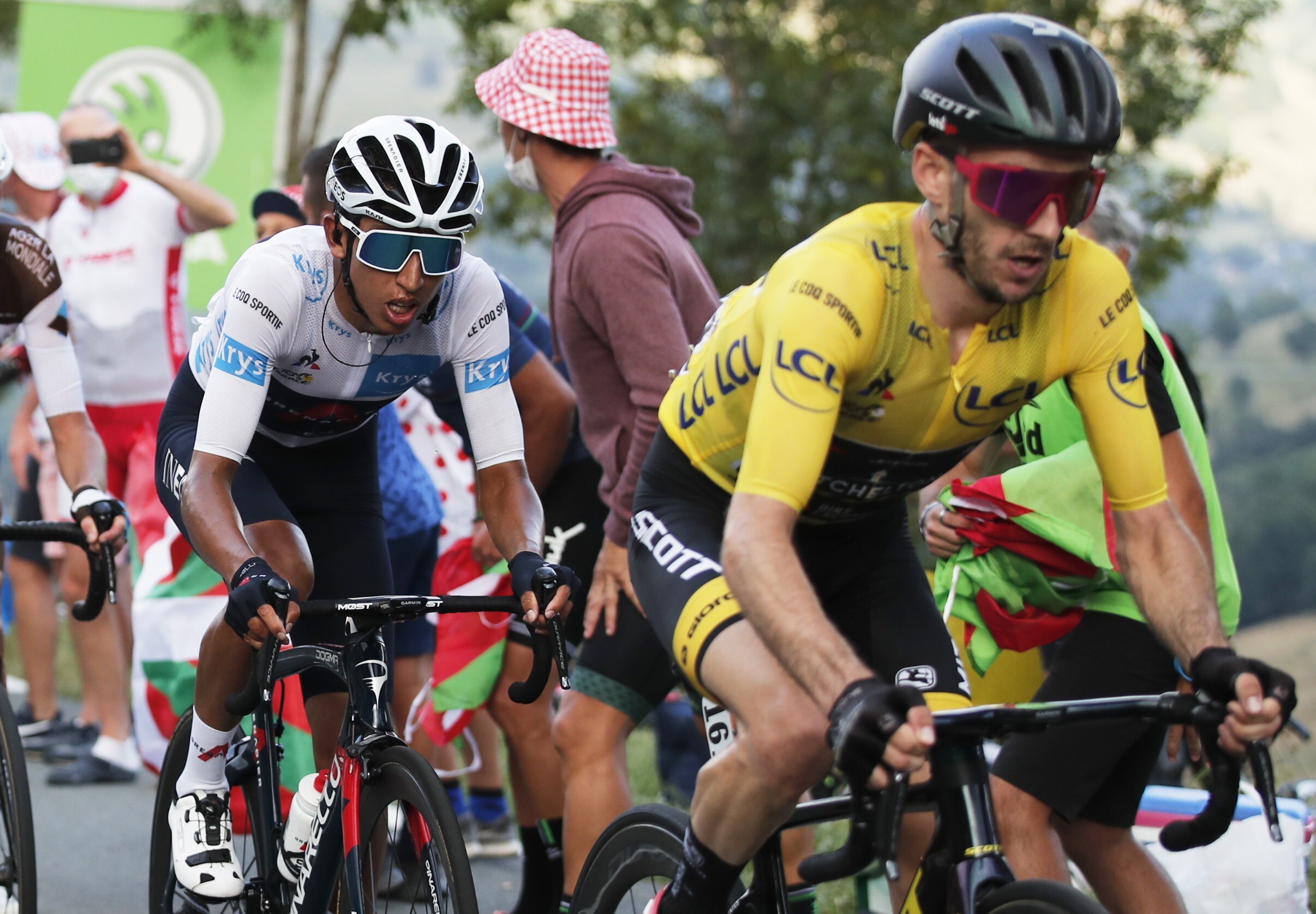 Mitchelton-Scott rider Adam Yates of Britain, wearing the overall leader’s yellow jersey, and Team INEOS Grenadiers rider Egan Bernal of Colombia, wearing the white jersey for best young rider, in action. Photo: Reuters
