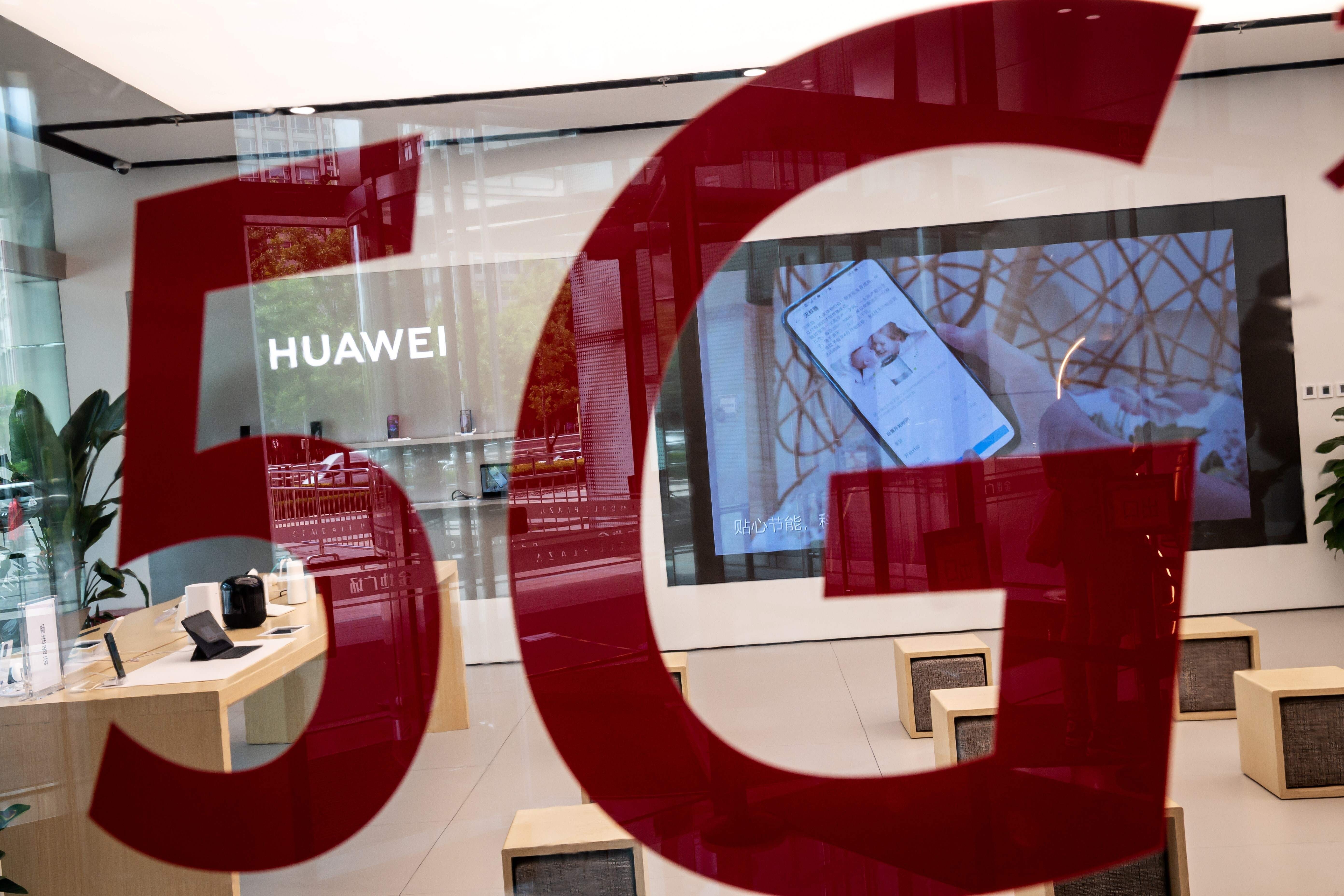 A shop for Chinese telecom giant Huawei displays a 5G logo in Beijing on May 25, 2020. Photo: AFP
