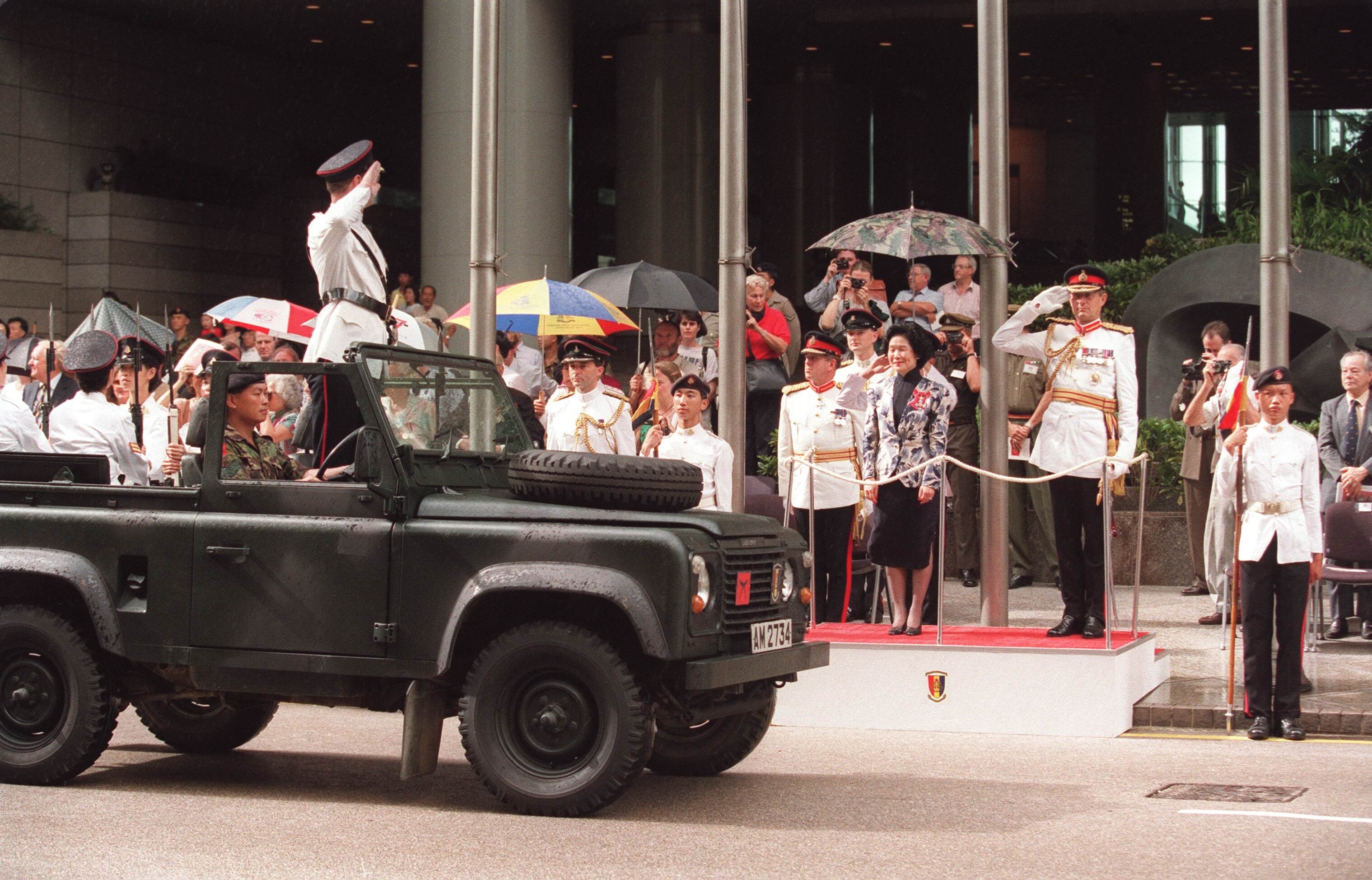 The Volunteers’ final parade passes by chief secretary Anson Chan on September 2, 1995. Photo: SCMP