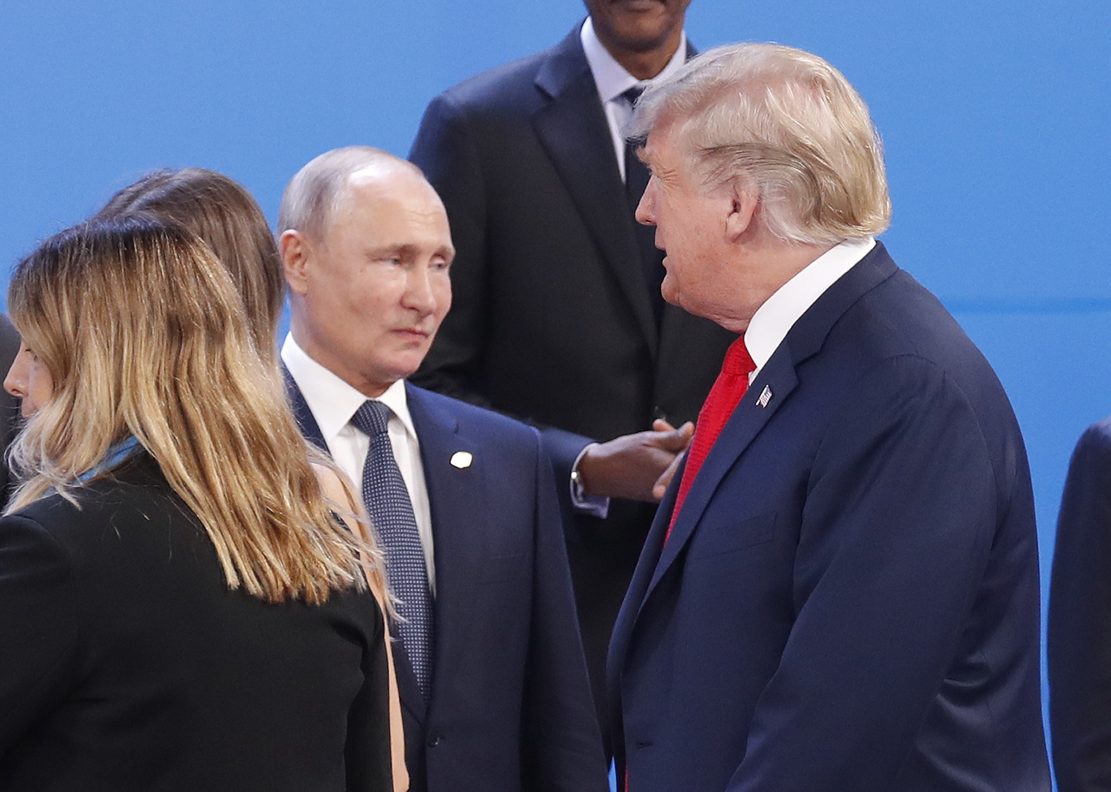 US President Donald Trump (right) walks past Russia’s President Vladimir Putin as they prepare for a group photo at the start of the G20 summit in Buenos Aires in November 2018. Photo: AP
