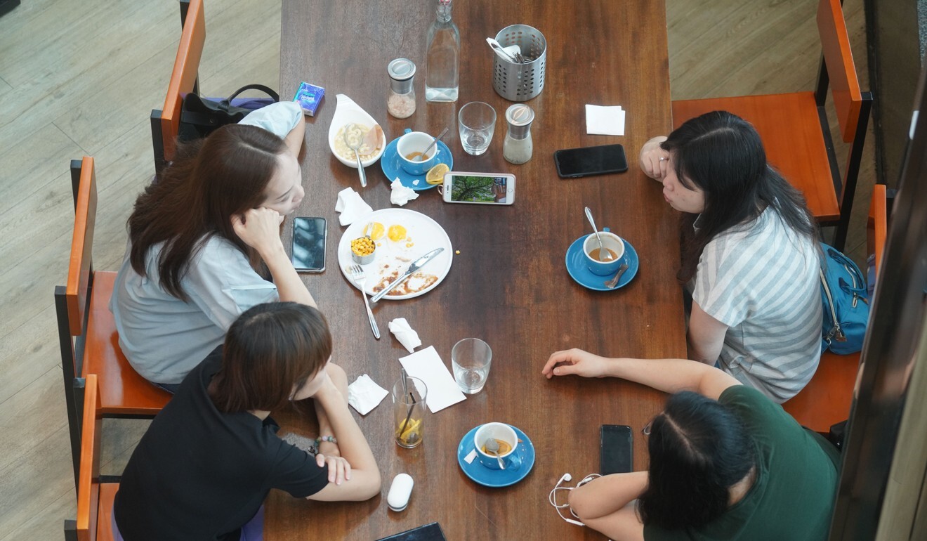 A group of friends have lunch together at a restaurant in Hollywood Plaza, on Diamond Hill.  Photo: Winson Wong