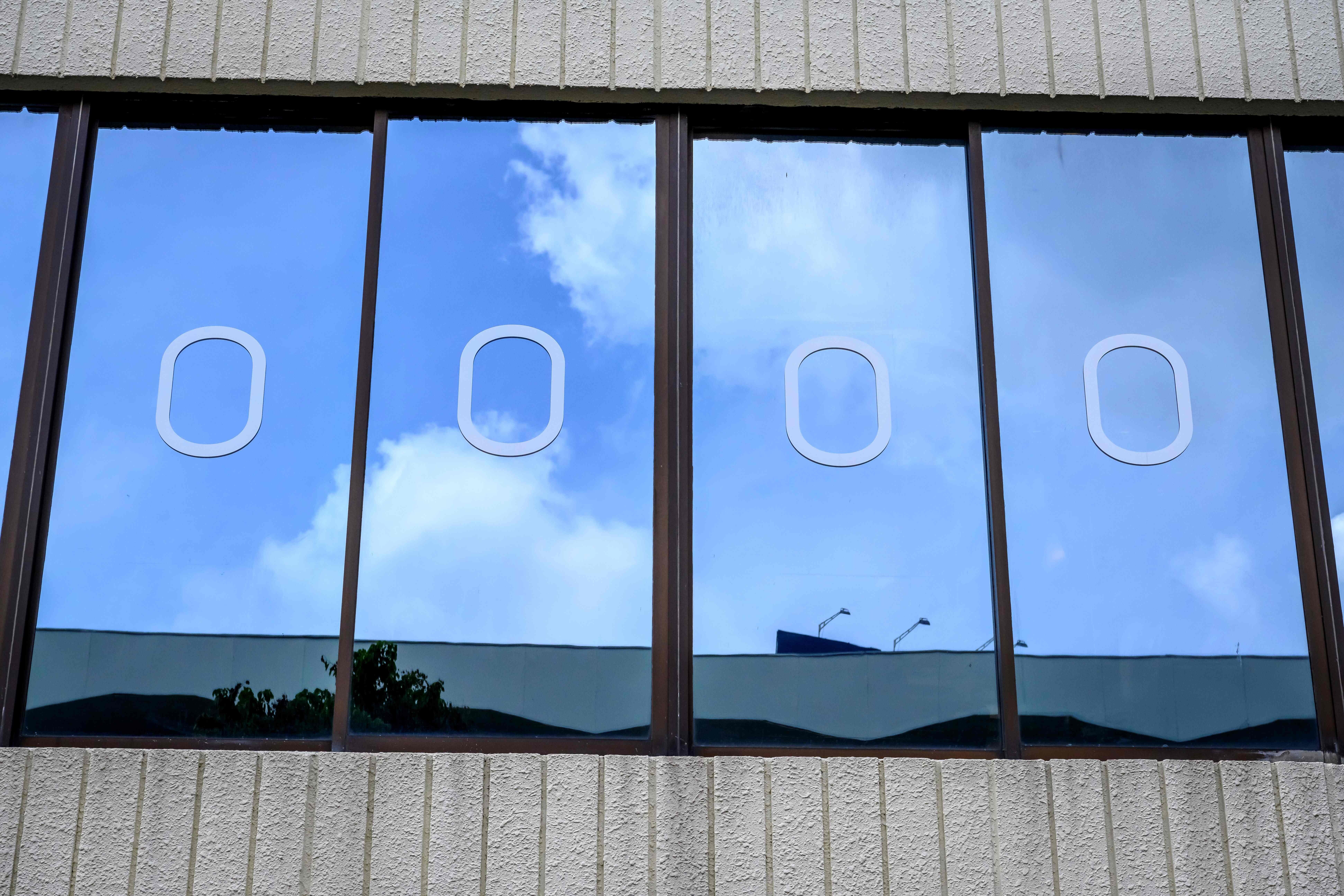 Decorations to simulate plane windows are seen on the exteriors of a Thai Airways pop-up aeroplane-themed restaurant in Bangkok on September 10. Coronavirus-safe travel bubbles have the potential to restart business and leisure travel in Asia, but only if robust procedures and guidelines are in place. Photo: AFP