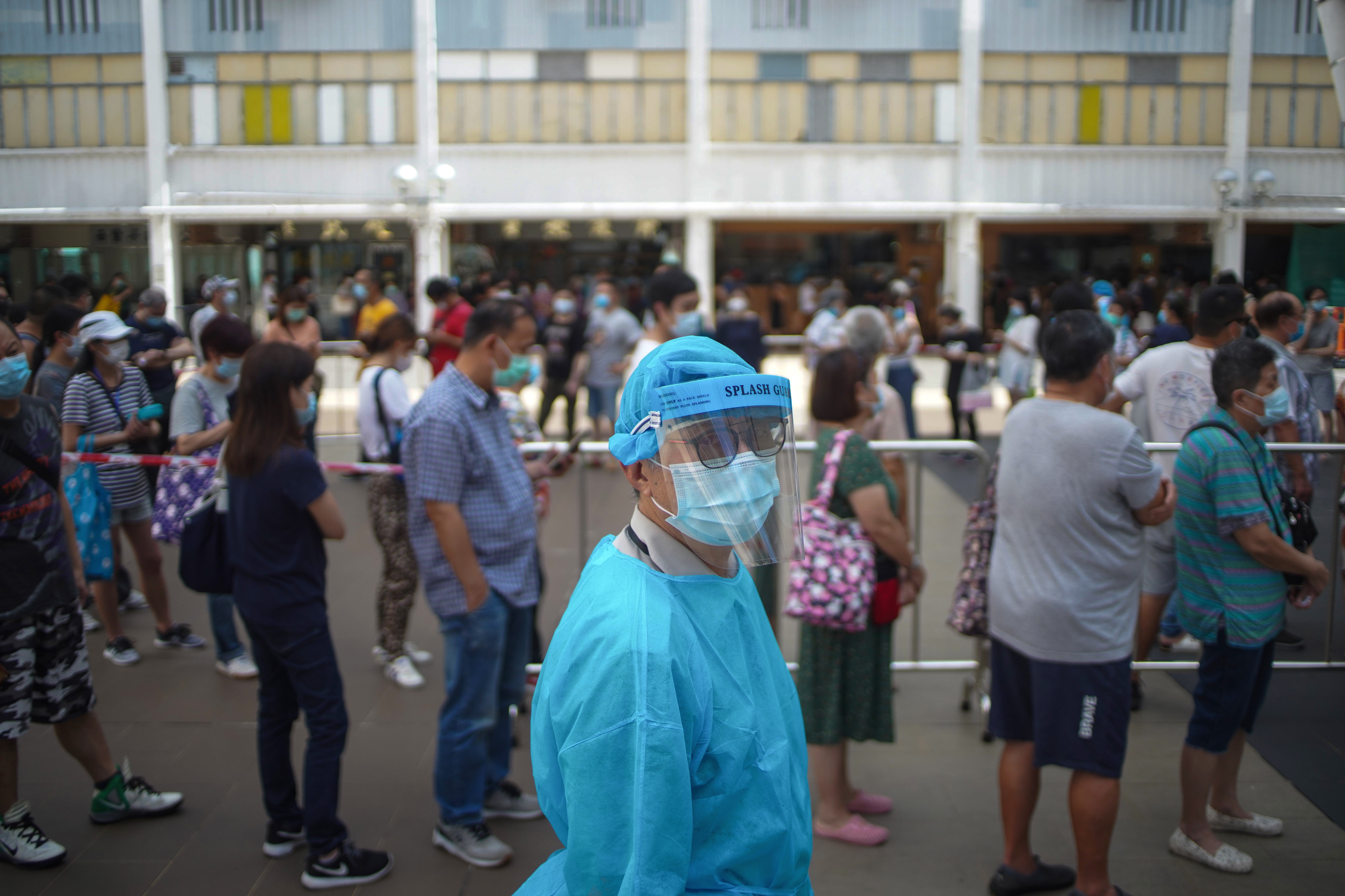 Residents submit their deep-throat saliva samples for Covid-19 testing at Ping Shek Estate in Kwun Tong on July 7. Despite Hong Kong’s socioeconomic gaps, residents have access to top-notch health care. Photo: Winson Wong