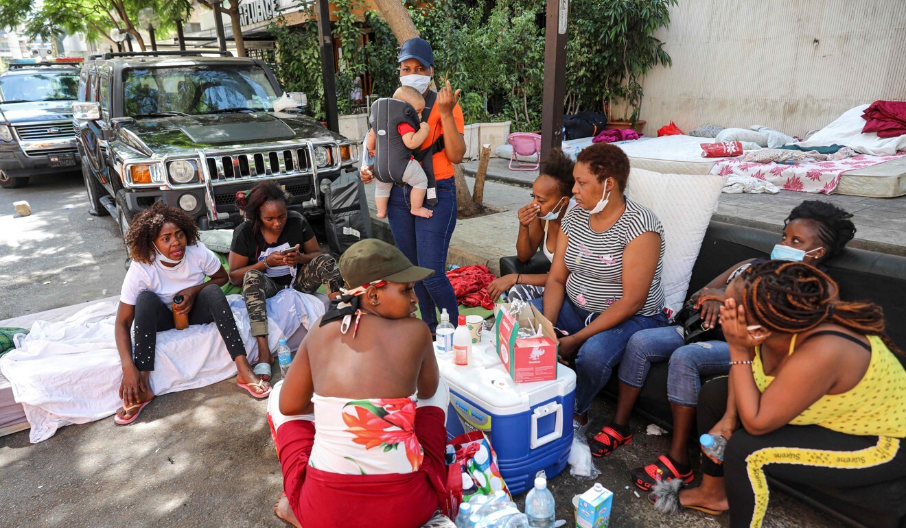 Kenyan women, employed in Lebanon as domestic workers, gather next to the Kenyan consulate in the capital Beirut, as they demand to be repatriated back to their country. Photo: AFP