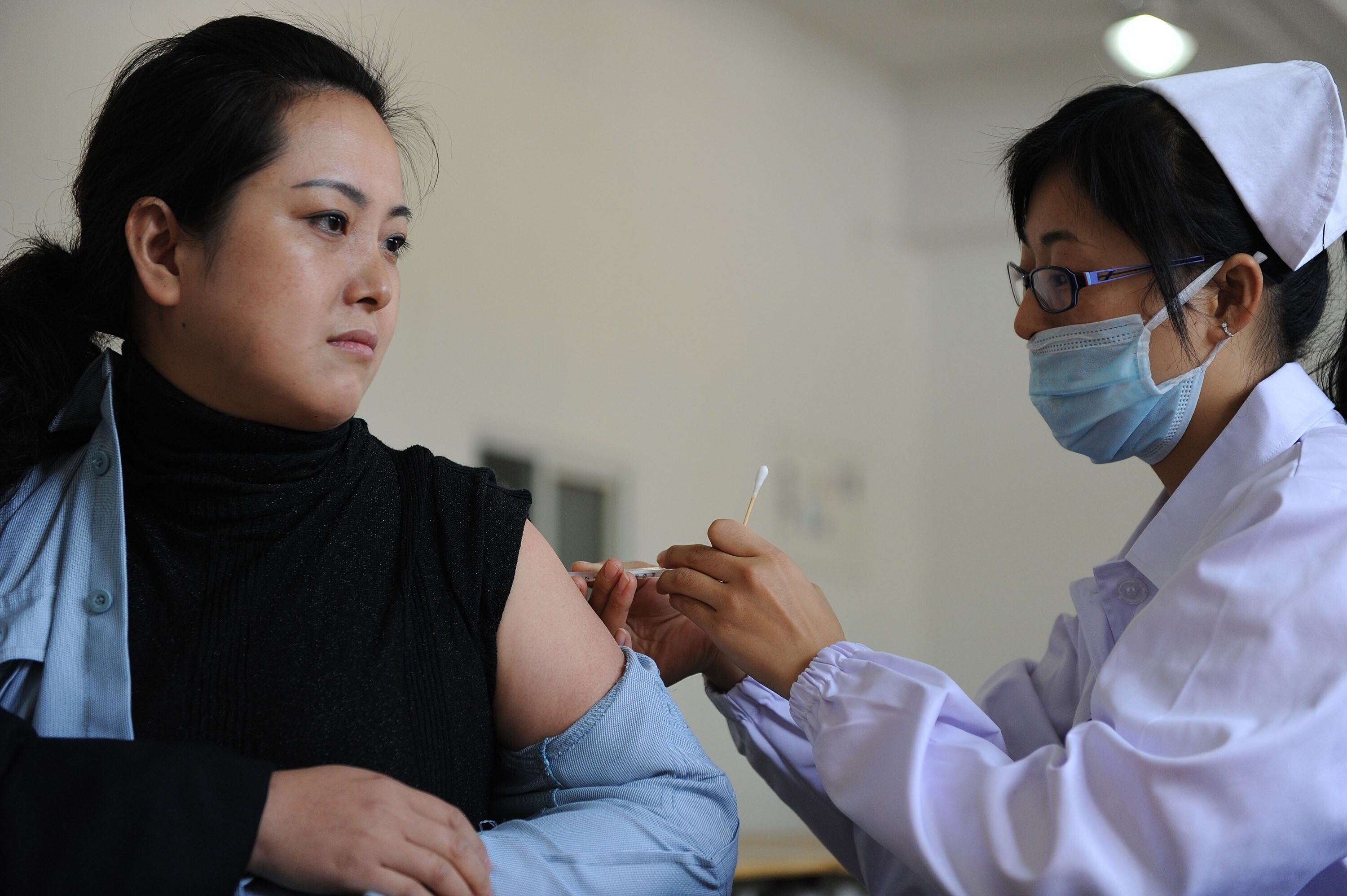 China is ramping up production of flu vaccines to ward off double threat of influenza and Covid-19. Photo: AFP