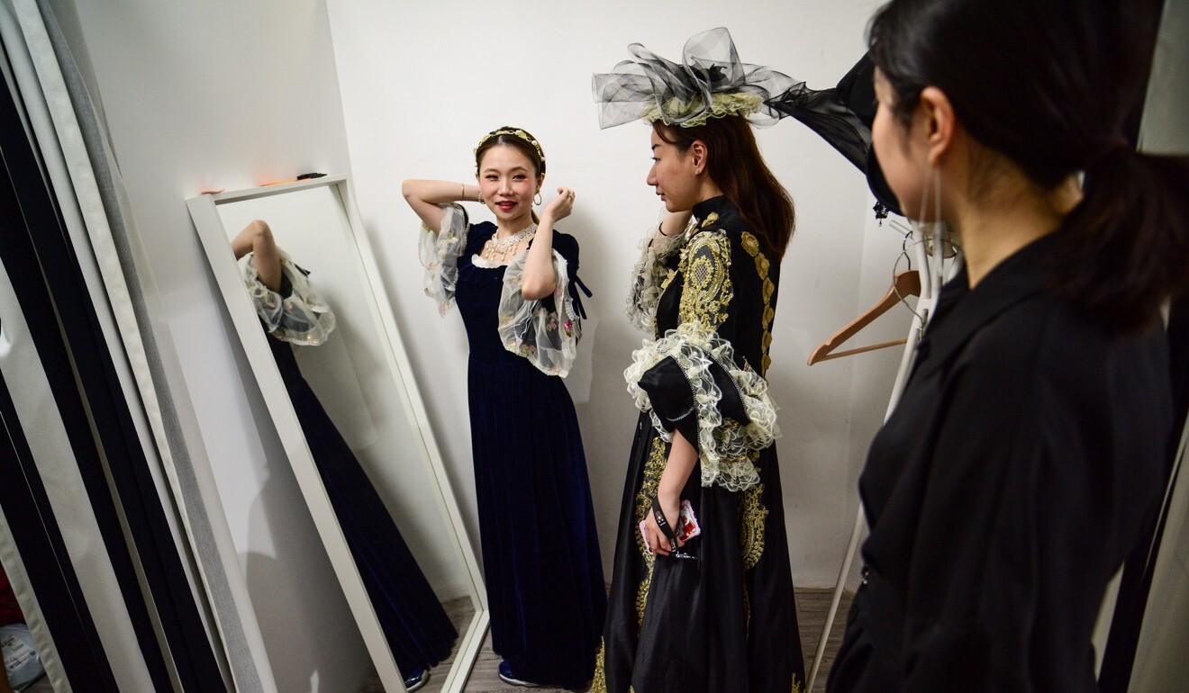 Role-players in a live-action murder mystery game in Shanghai get into character with elaborate costumes. Photo: AFP