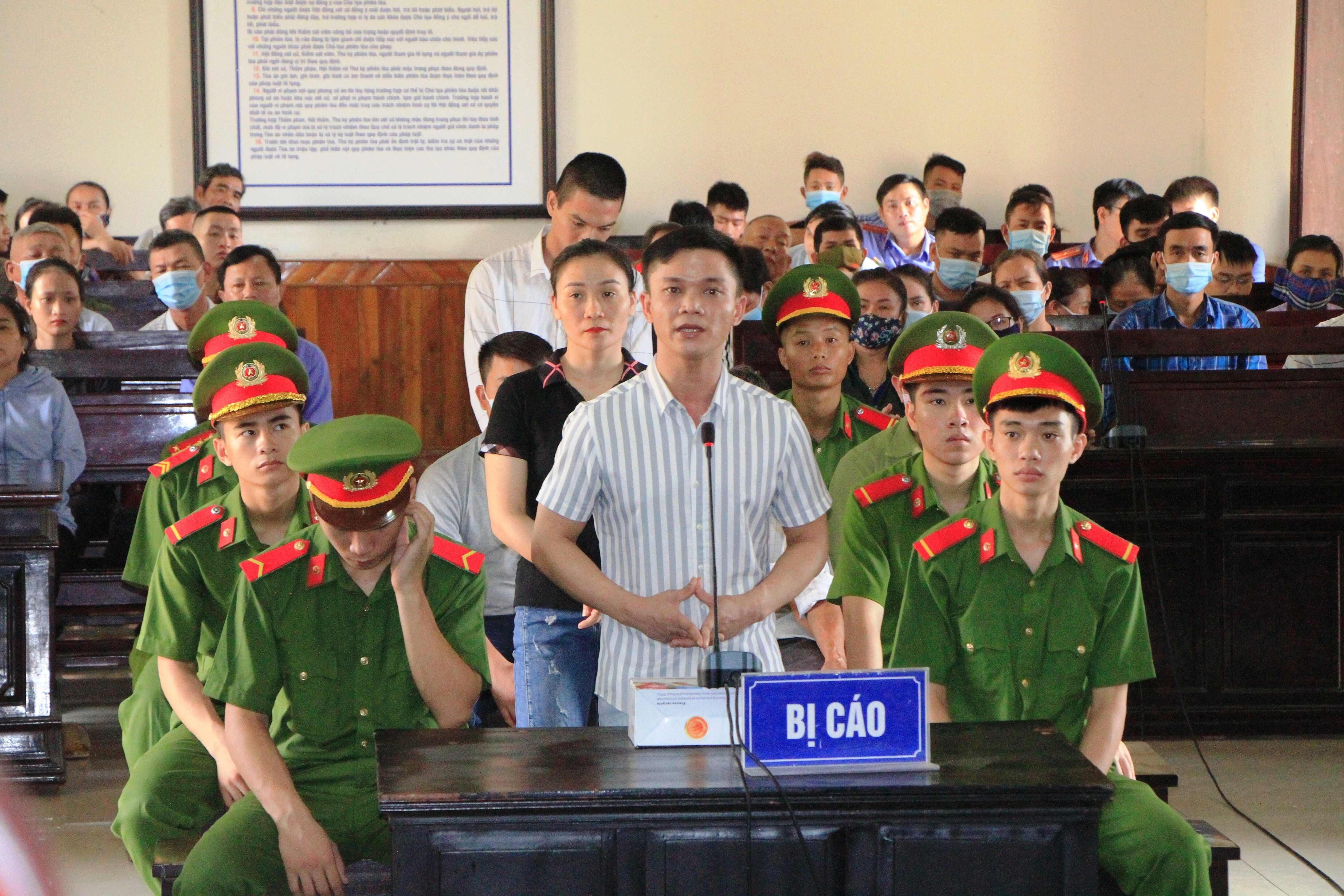 Defendants are seen during a trial in Ha Tinh province against those involved in the deaths of 39 migrants found in a refrigerated truck in Britain last year. Photo: AFP