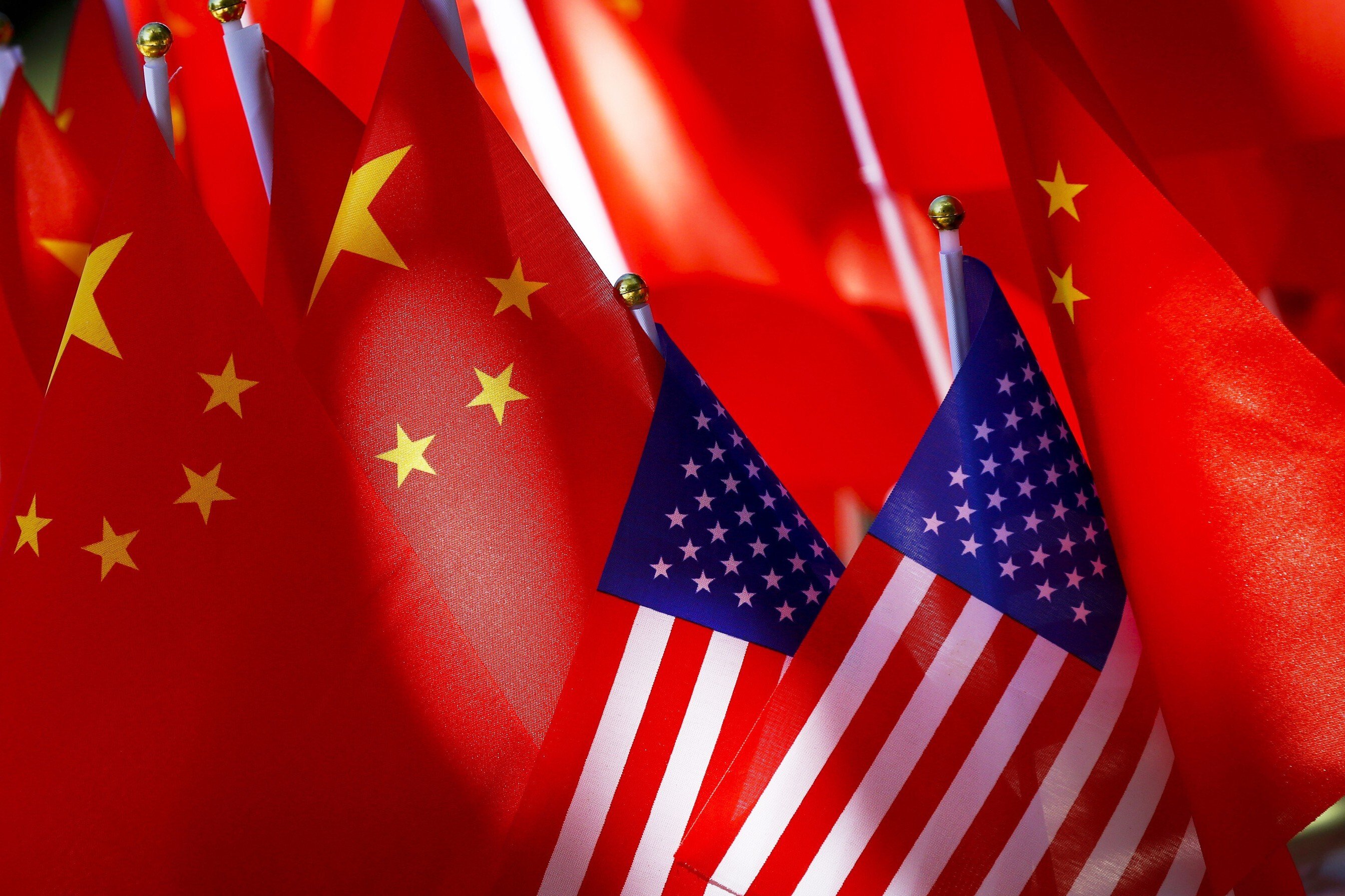 American flags are displayed together with Chinese flags in Beijing in 2018. If China and the United States continue on their current confrontational trajectory, other actors such as Asean might need to step in to prevent further global destabilisation. Photo: AP