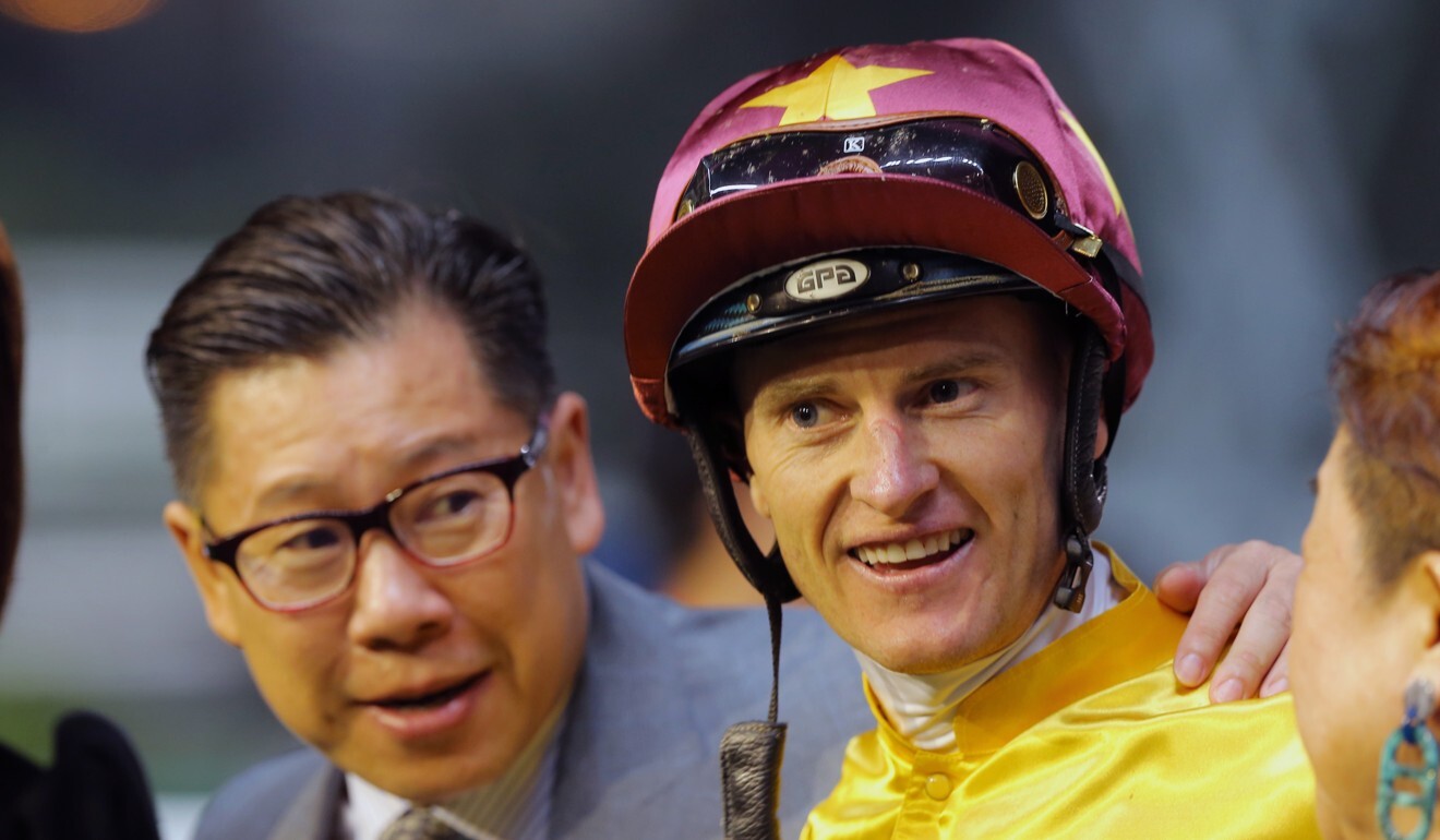 Dennis Yip and Zac Purton after a Happy Valley winner.