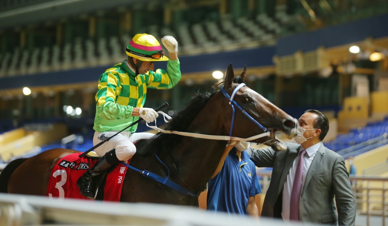 Joao Moreira celebrates with trainer Caspar Fownes during his treble at Happy Valley on Wednesday night.