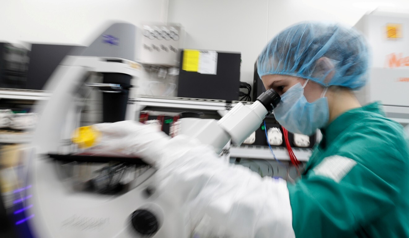 A scientist examines Covid-19 infected cells during research for a vaccine in Saint Petersburg, Russia. Photo: Reuters