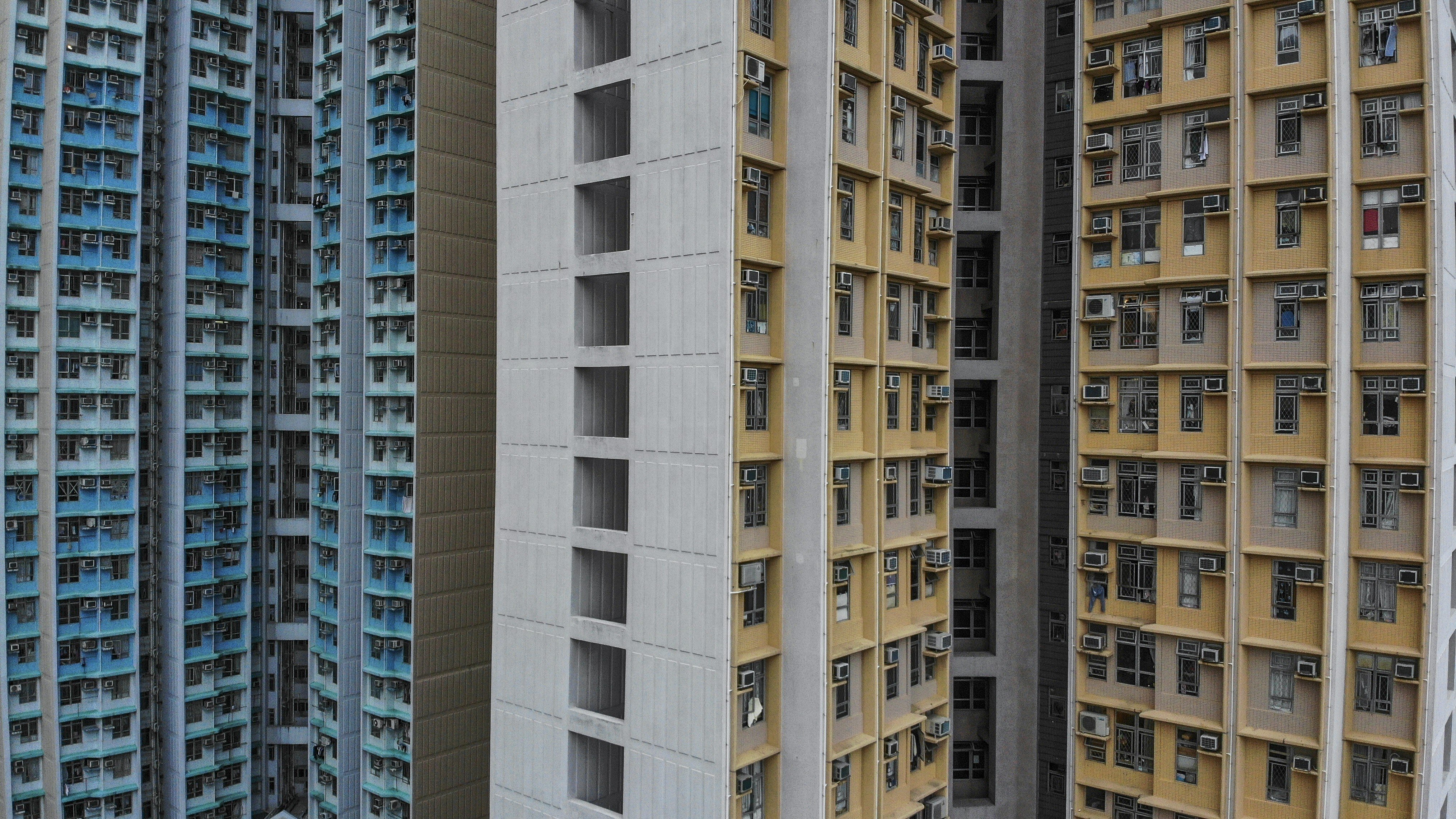 A public housing estate (left) stands next to Home Ownership Scheme housing in Shau Kei Wan in January 2019. Photo: Martin Chan