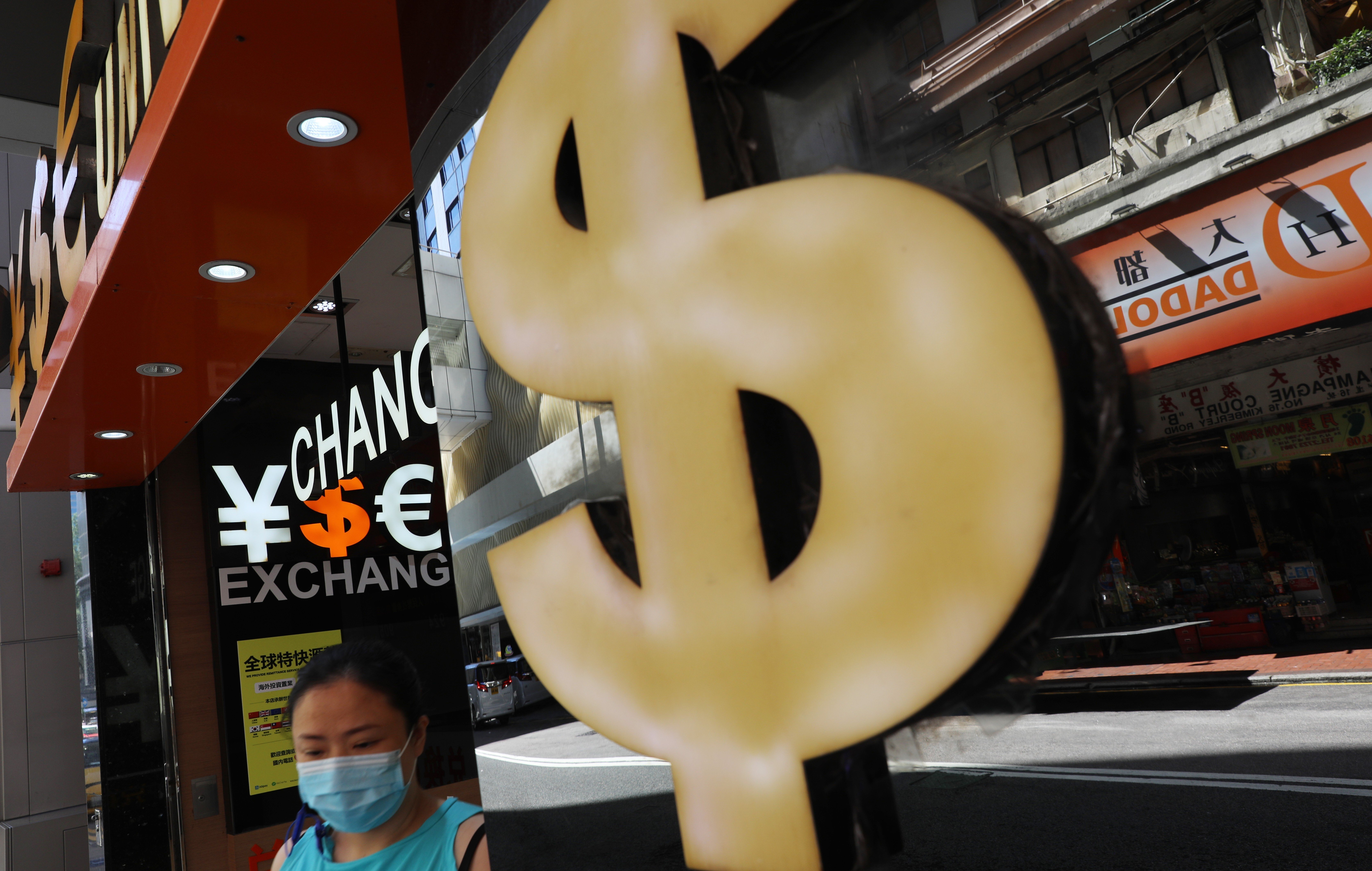 Exchange currency booths in Hong Kong. The recent dollar depreciation is a welcome reprieve for emerging economies. Photo:Sam Tsang