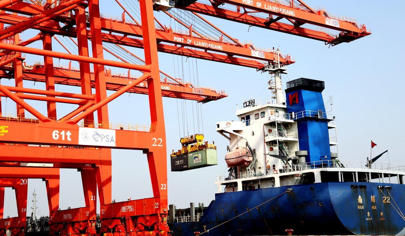 A freighter loads containers for export at a port in East China's Jiangsu Province on September 7. Photo: Xinhua