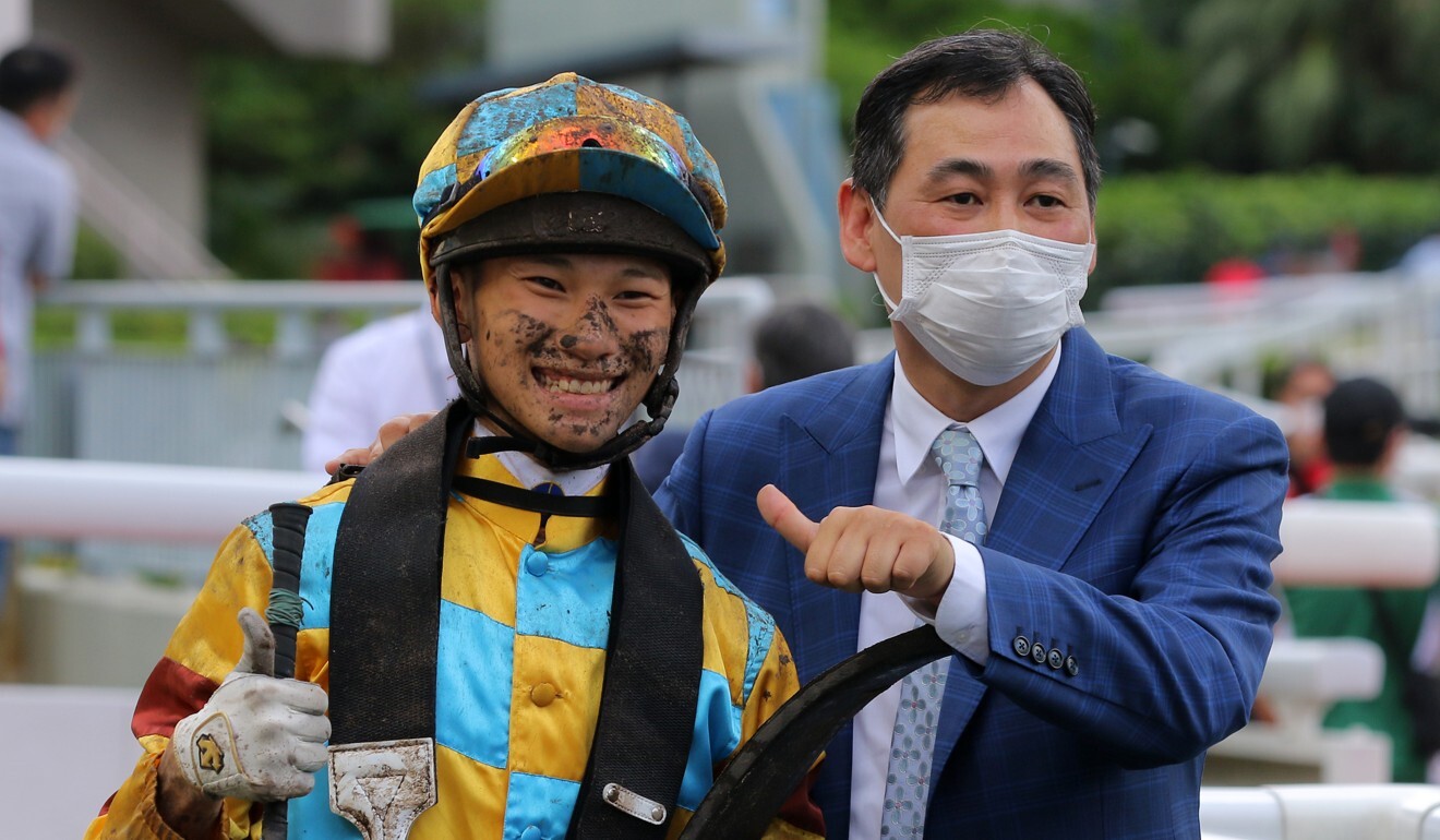 Jerry Chau enjoys a win with Michael Chang.