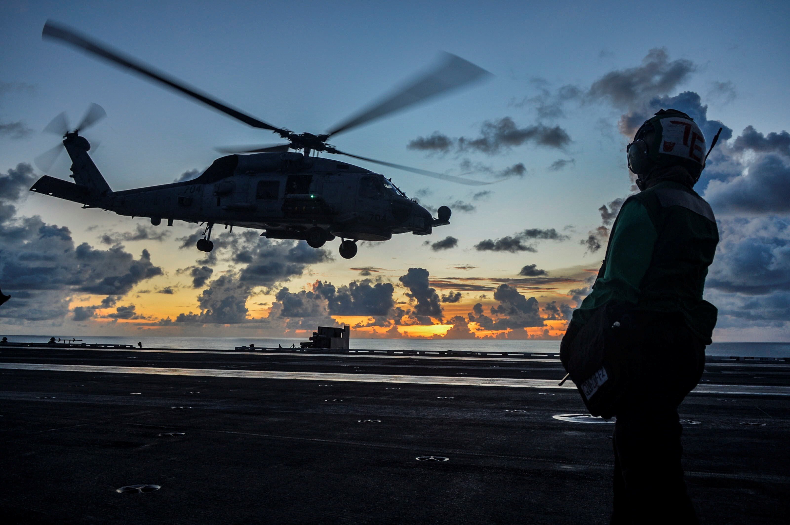 An MH-60R Sea Hawk helicopter launches off the USS Ronald Reagan in the South China Sea. Photo: Handout via Reuters
