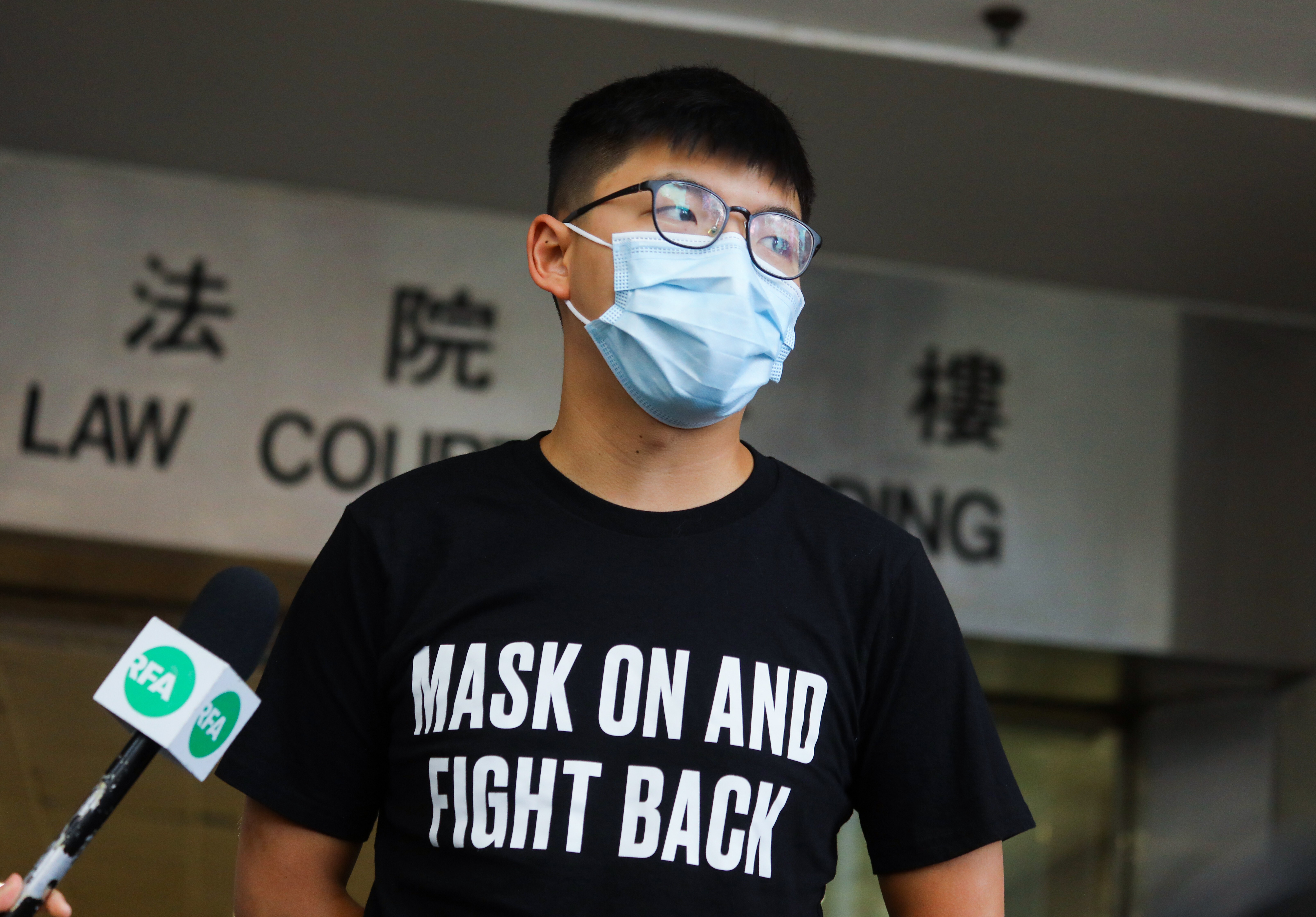 Activist Joshua Wong speaks to reporters after leaving Hong Kong’s Eastern Court on Wednesday. Photo: Xiaomei Chen