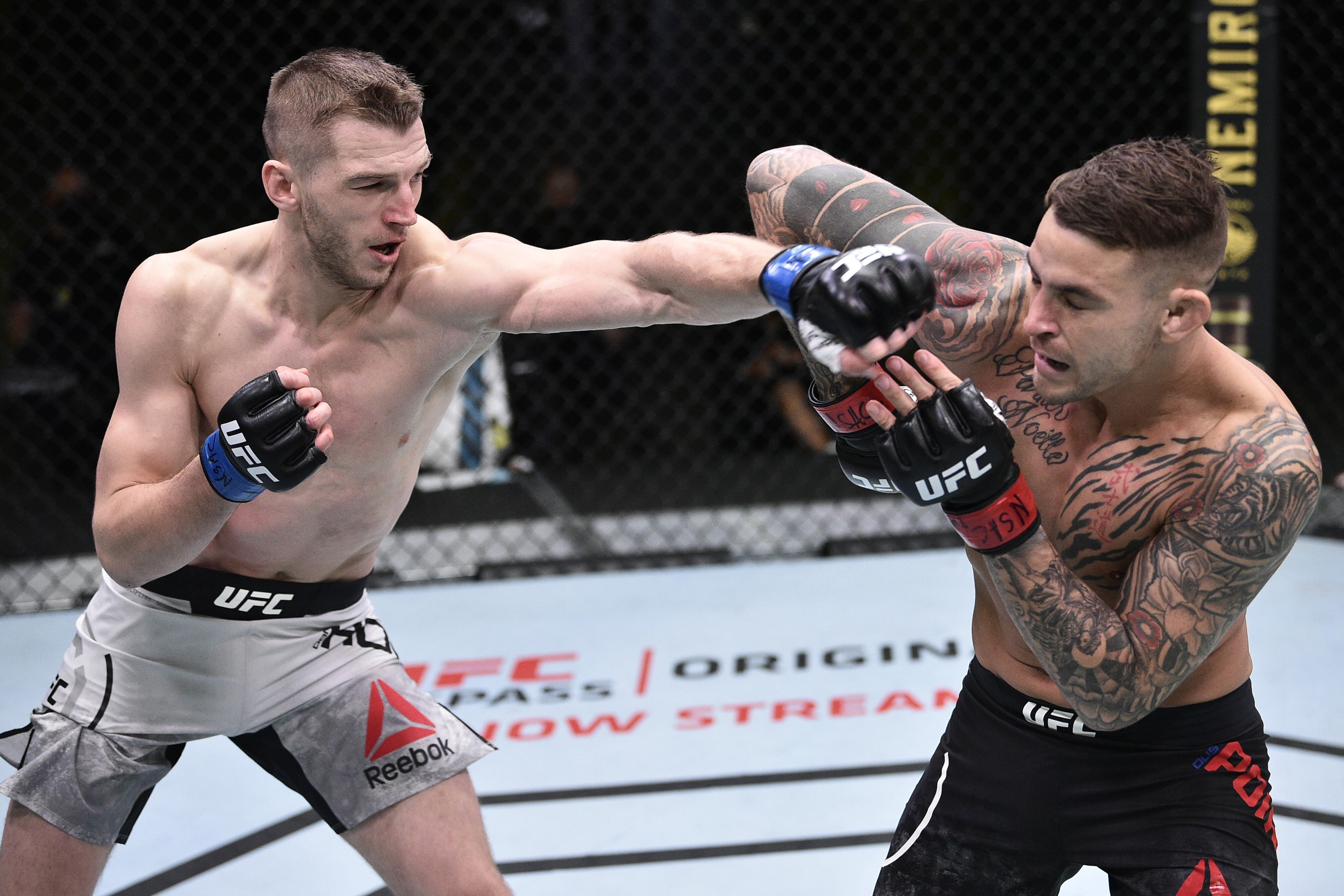 Dan Hooker punches Dustin Poirier during UFC Fight Night at the UFC Apex. Photo: Chris Unger/Zuffa LLC via USA TODAY Sports
