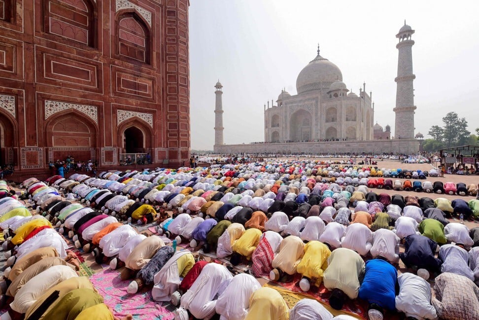 Indian Muslim devotees offer prayers during Eid ul-Fitr at the Taj Mahal in June last year. Photo: AFP