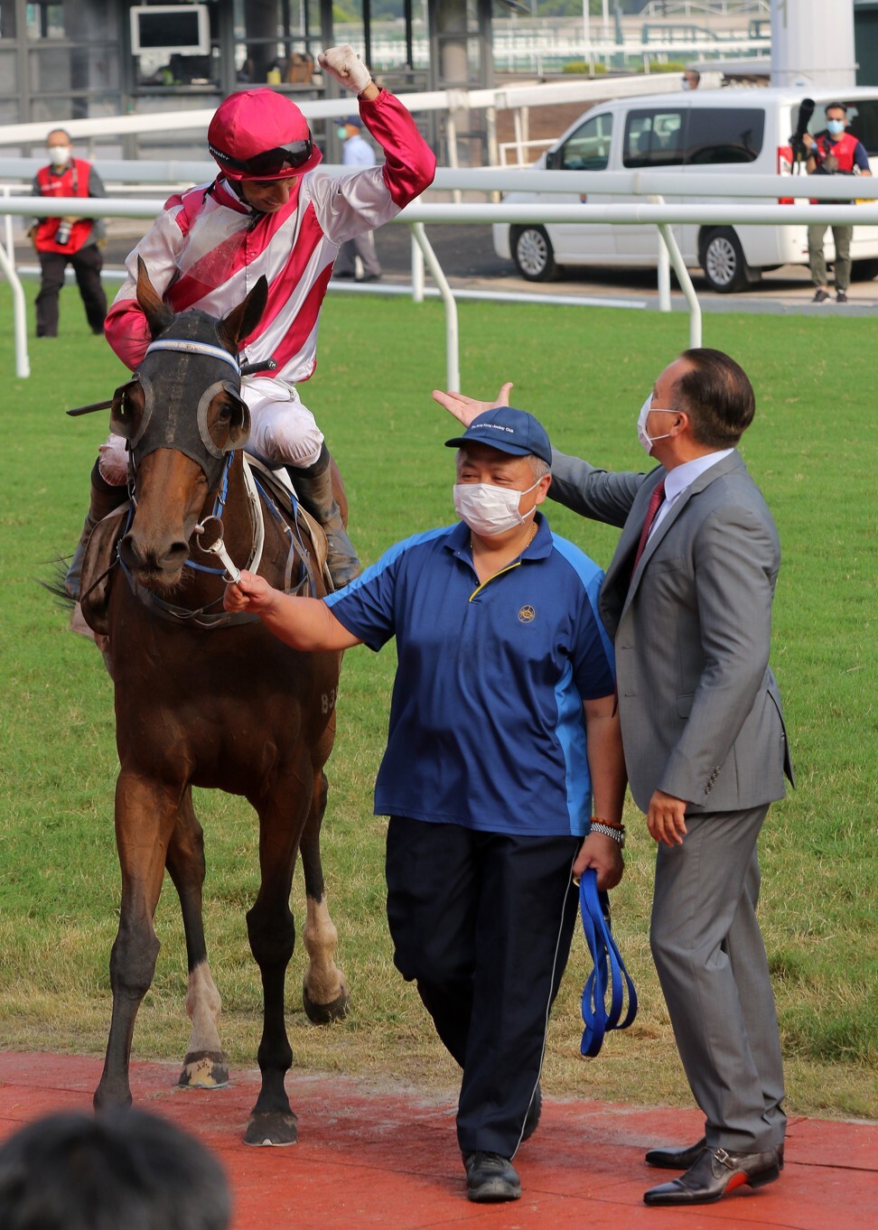 Joao Moreira and Caspar Fownes celebrate Enfolding’s win.