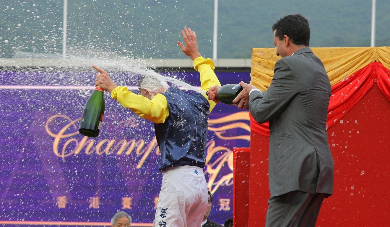 Douglas Whyte sprays Zac Purton with champagne after the Australian won the 2018-19 jockeys’ championship.