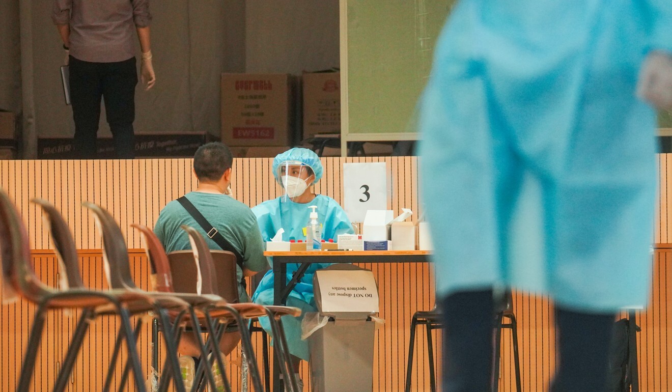 A resident participates in the citywide Covid-19 mass testing scheme in Wong Tai Sin in September. Photo: Winson Wong