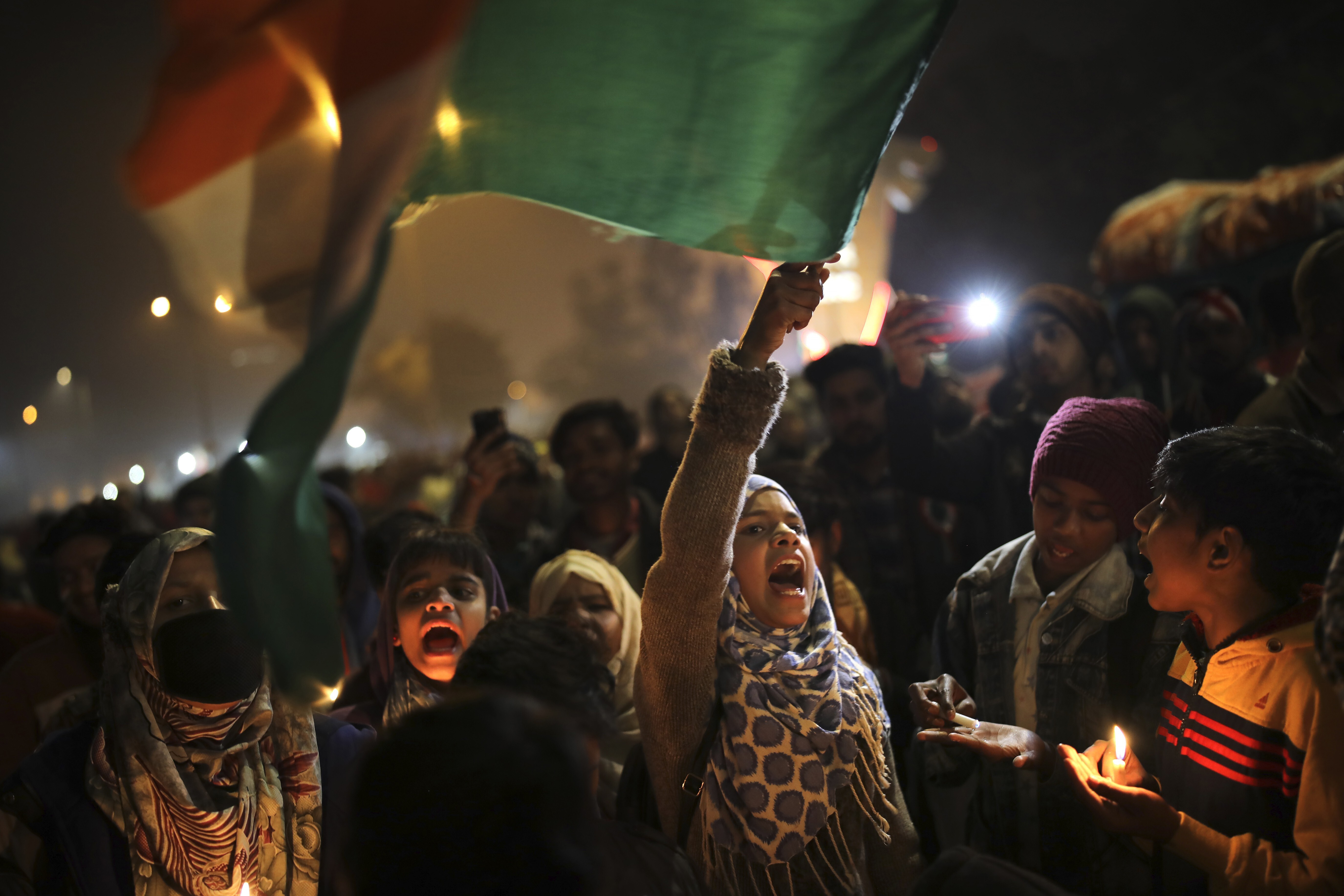 A girl waves the Indian flag as she shouts slogans at a protest site in the Shaheen Bagh neighbourhood of New Delhi on January 21. Photo: AP