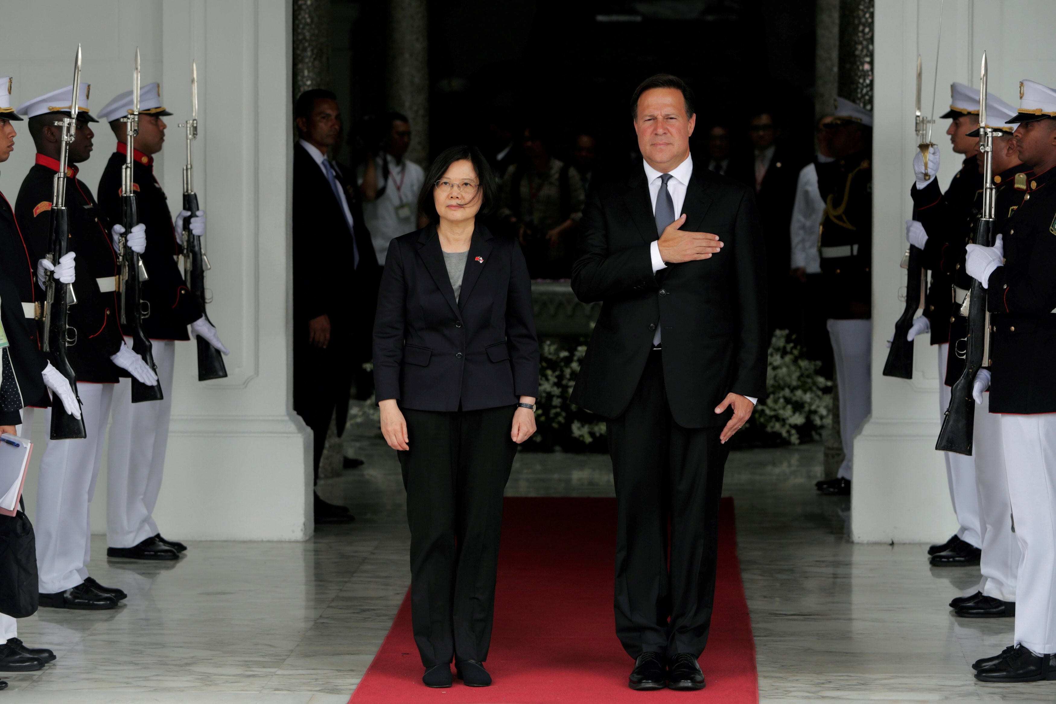 Taiwan’s leader Tsai Ing-wen and former president of Panama Juan Carlos Varela listen to Panama’s national anthem during a welcome ceremony before a meeting in Panama City in June 2016. Panama has since opted to establish diplomatic relations with Beijing, severing its relations with Taipei. Photo: Reuters