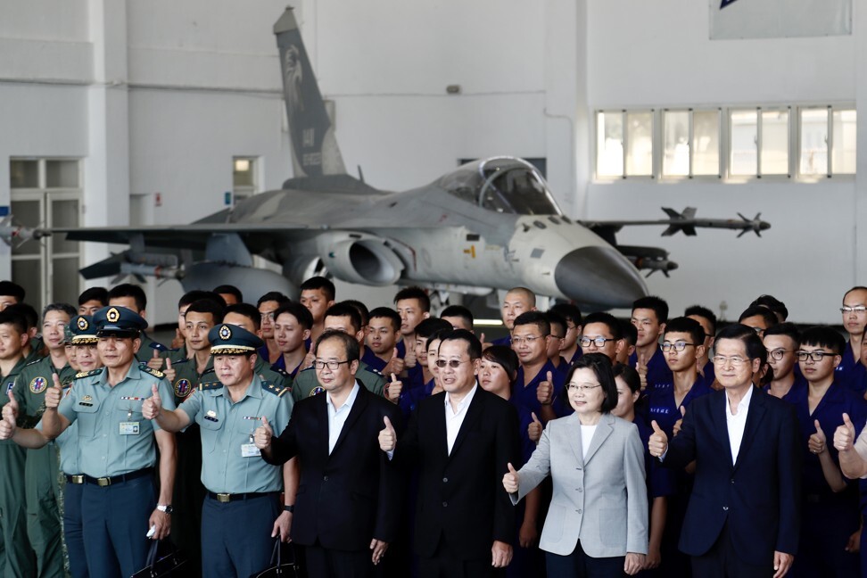 Taiwanese President Tsai Ing-wen poses with air force officials and personnel during her visit at a military base on Penghu Island last month. Photo: EPA-EFE