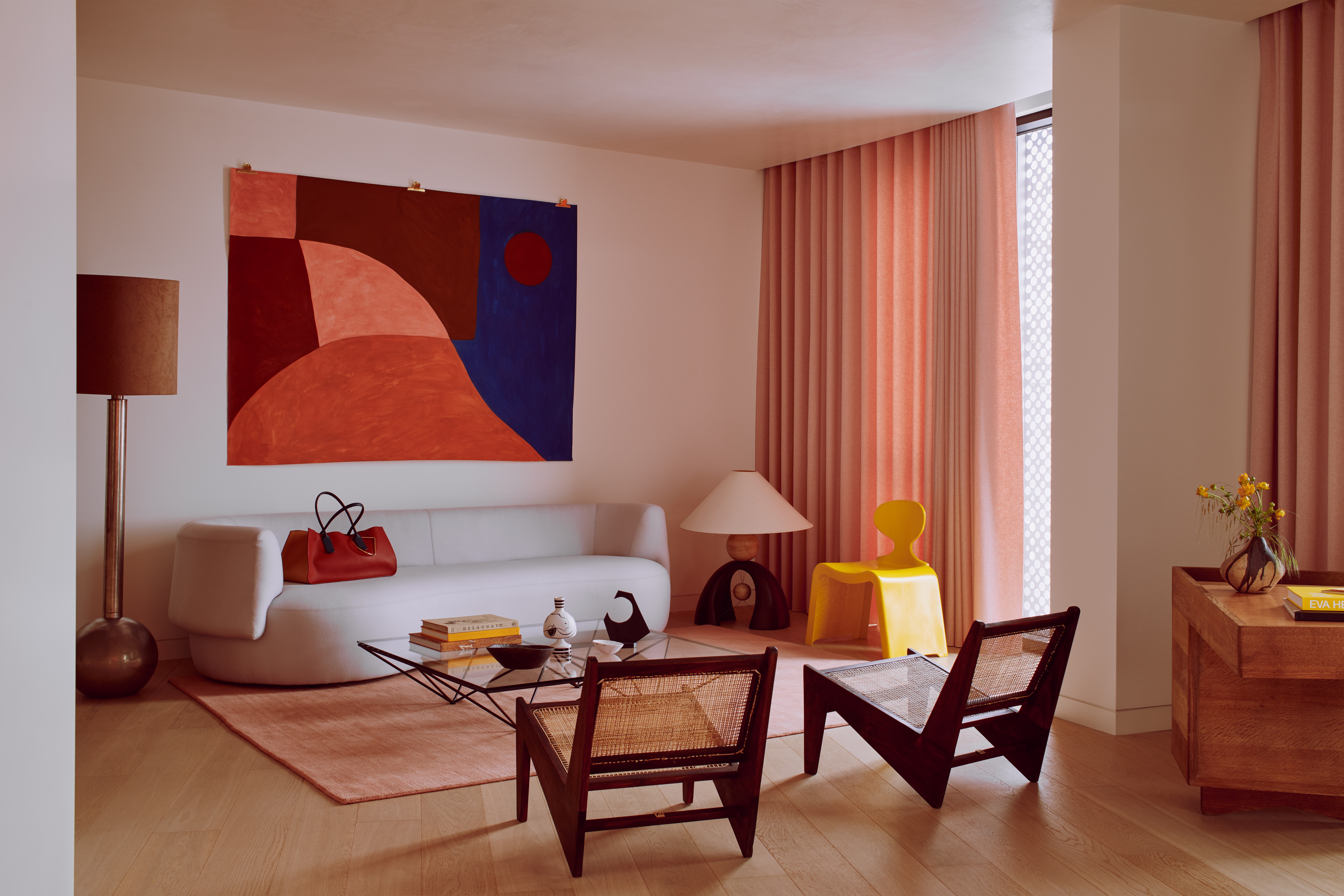 The Gasholders Penthouse’s living room is uncluttered, allowing the furniture and artworks – including the mural by Caroline Denervaud – to claim the attention they deserve. Photo: Michael Sinclair