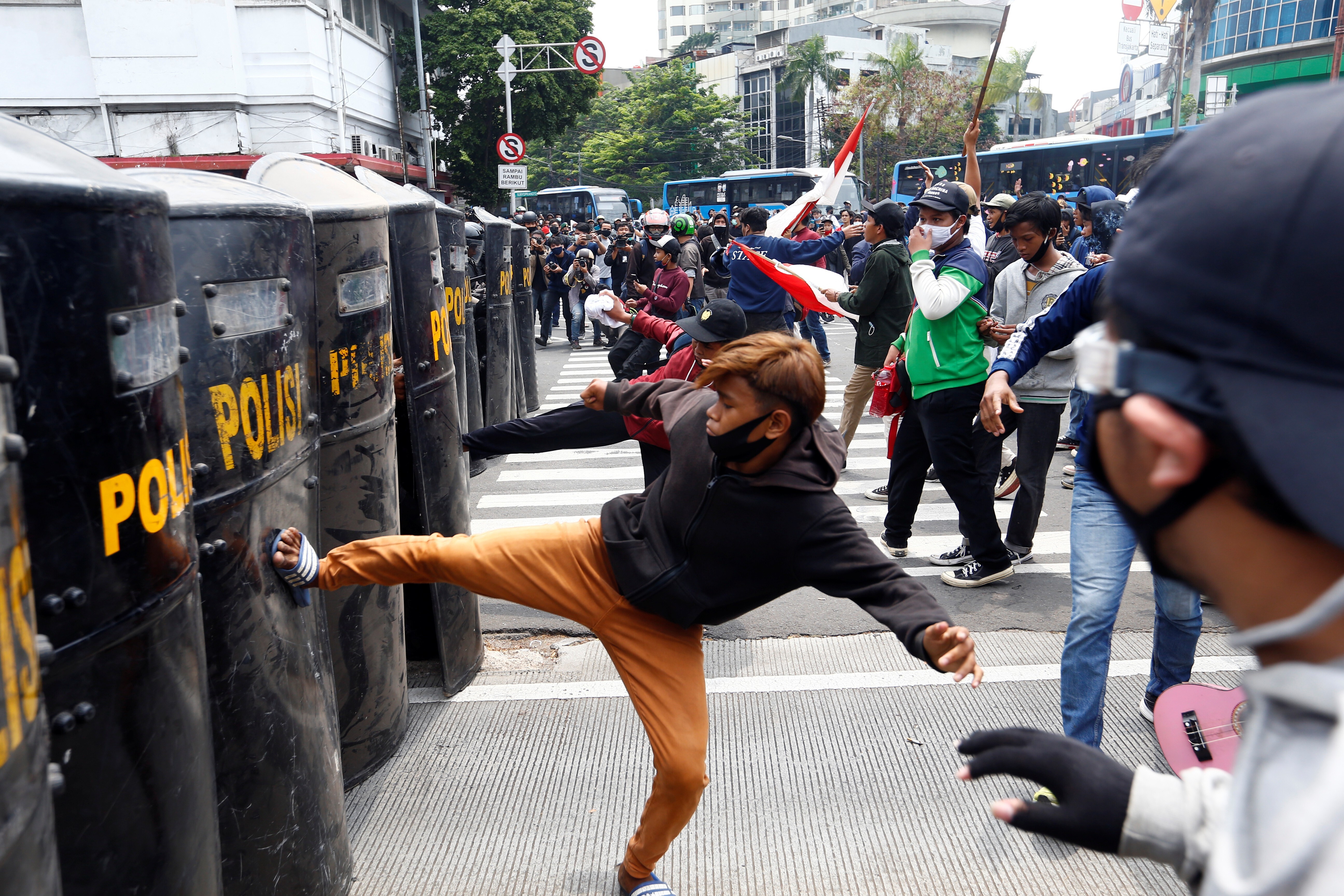 Demonstrators clash with police officers in Jakarta on October 8, 2020. Photo: Reuters