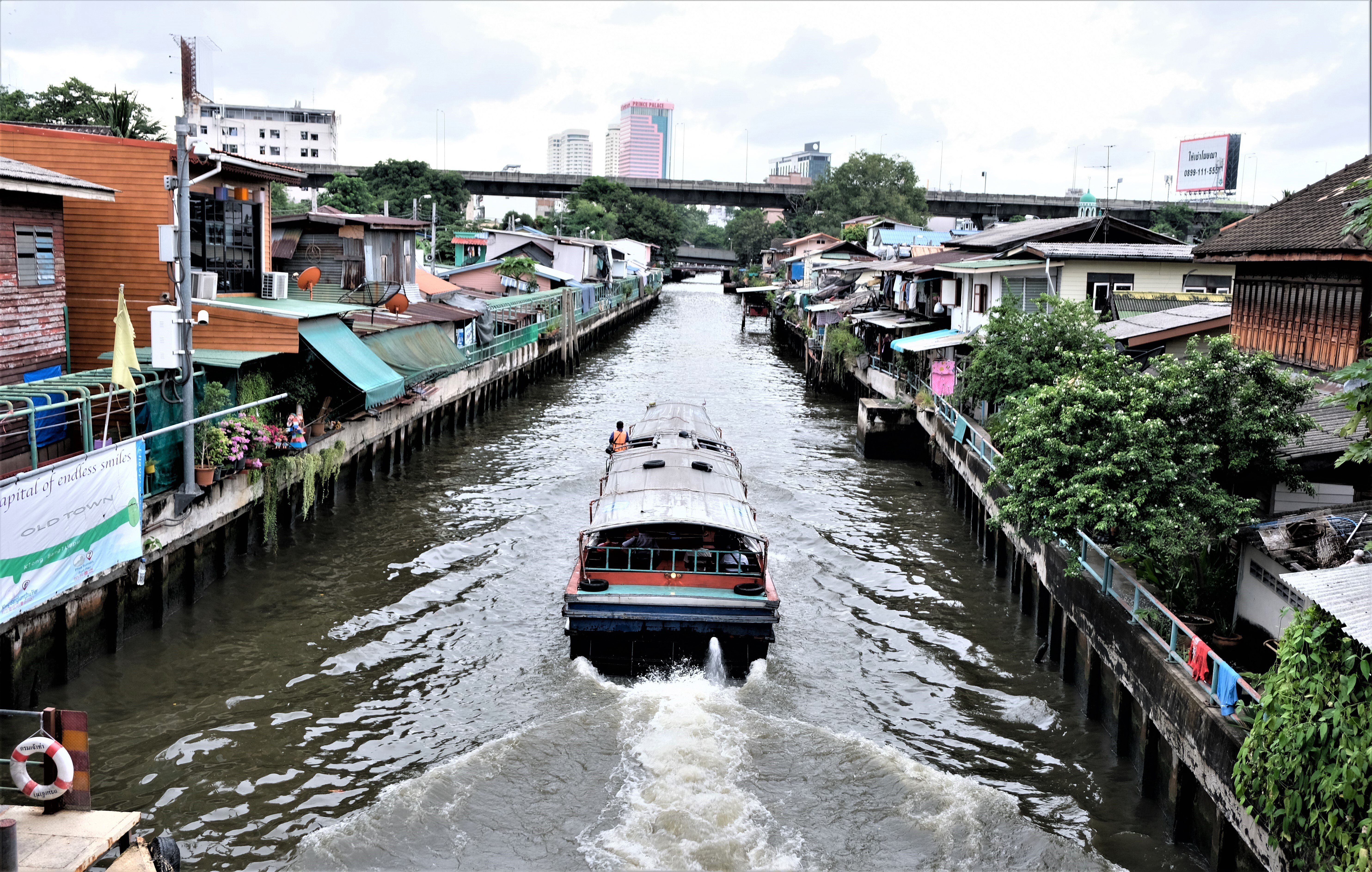 A passenger boat passes the Baan Khrua neighbourhood in central Bangkok. Photo: Tibor Krausz
