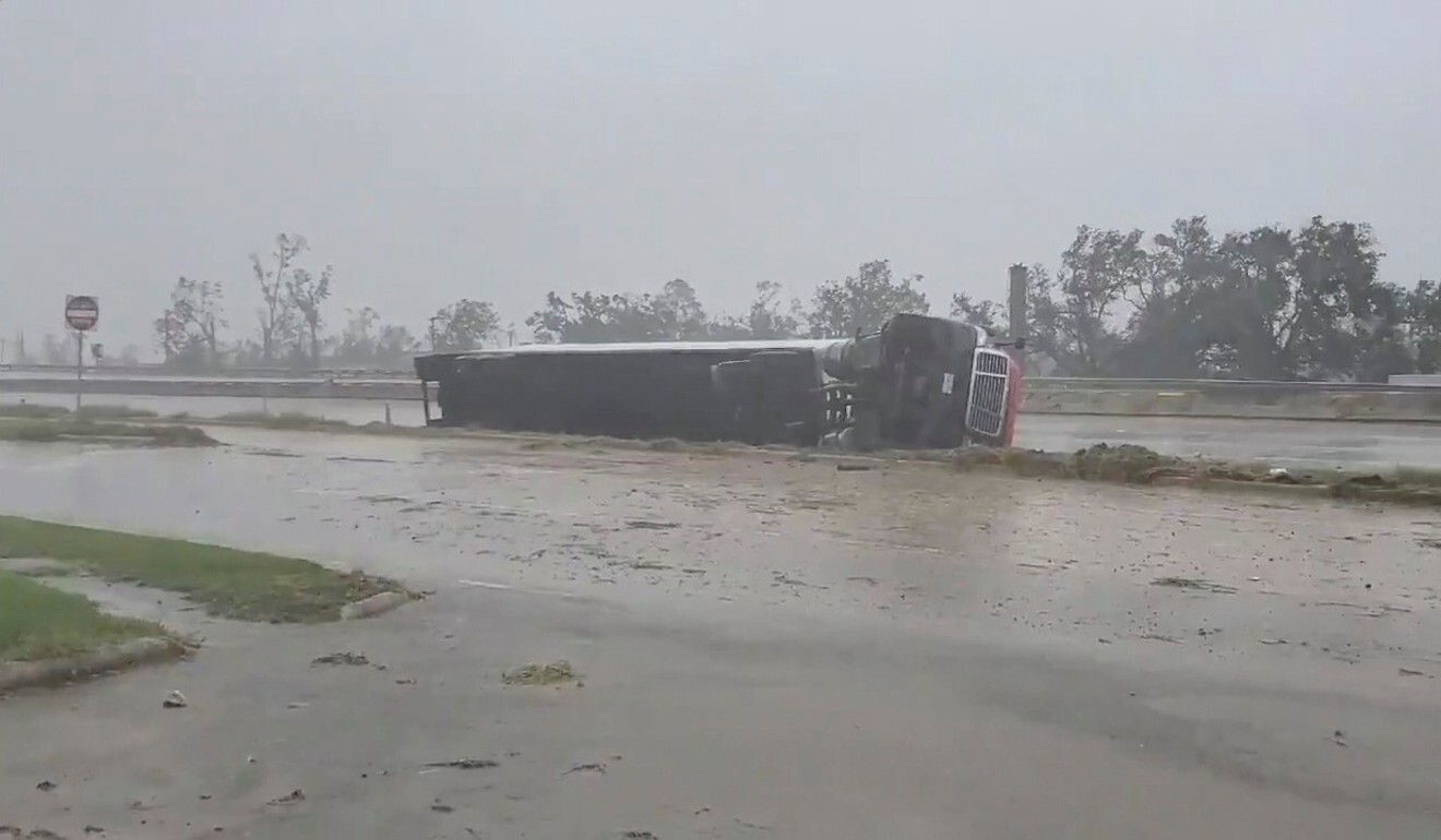 A truck flipped on its side at Lake Charles due to winds from Hurricane Delta. Photo: Reuters