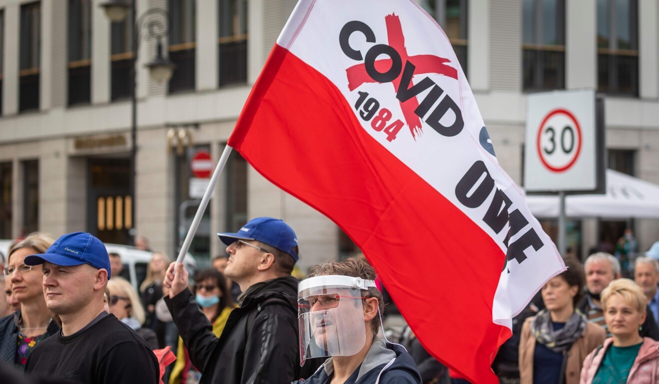 People protest against mandatory mask wearing in Warsaw on Saturday after the Polish government tightened restrictions. Photo: AFP