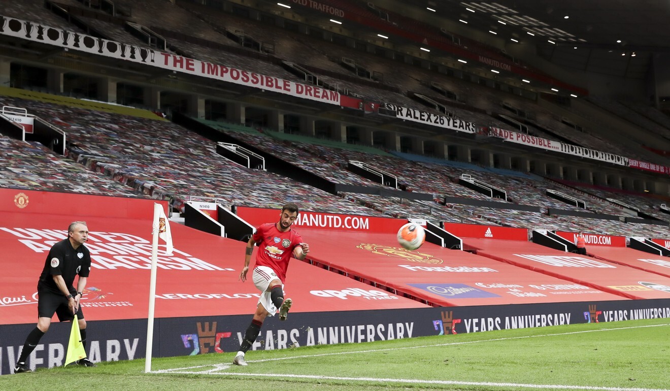 Bruno Fernandes of Manchester United takes a corner at an empty Old Trafford. Photo: EPA