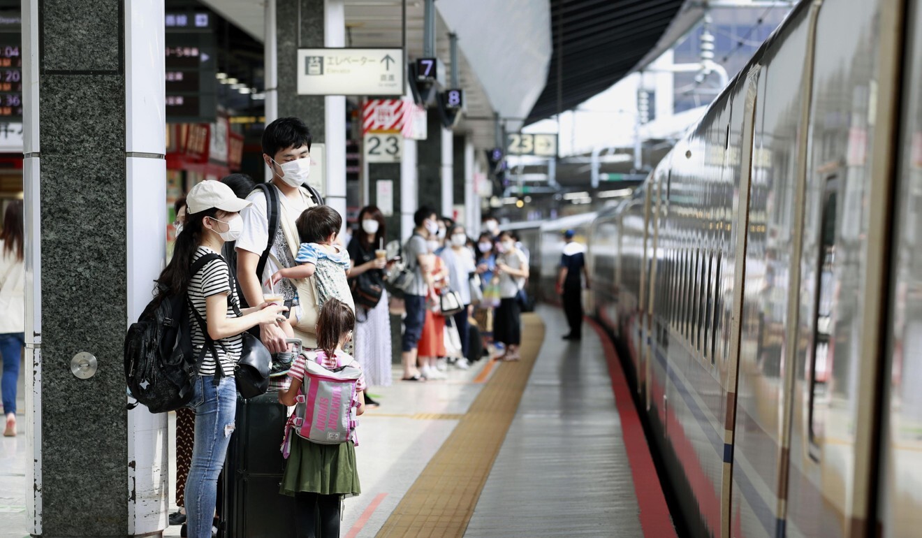 Passengers wait to board a shinkansen bullet train at JR Tokyo Station in Japan. Photo: Kyodo